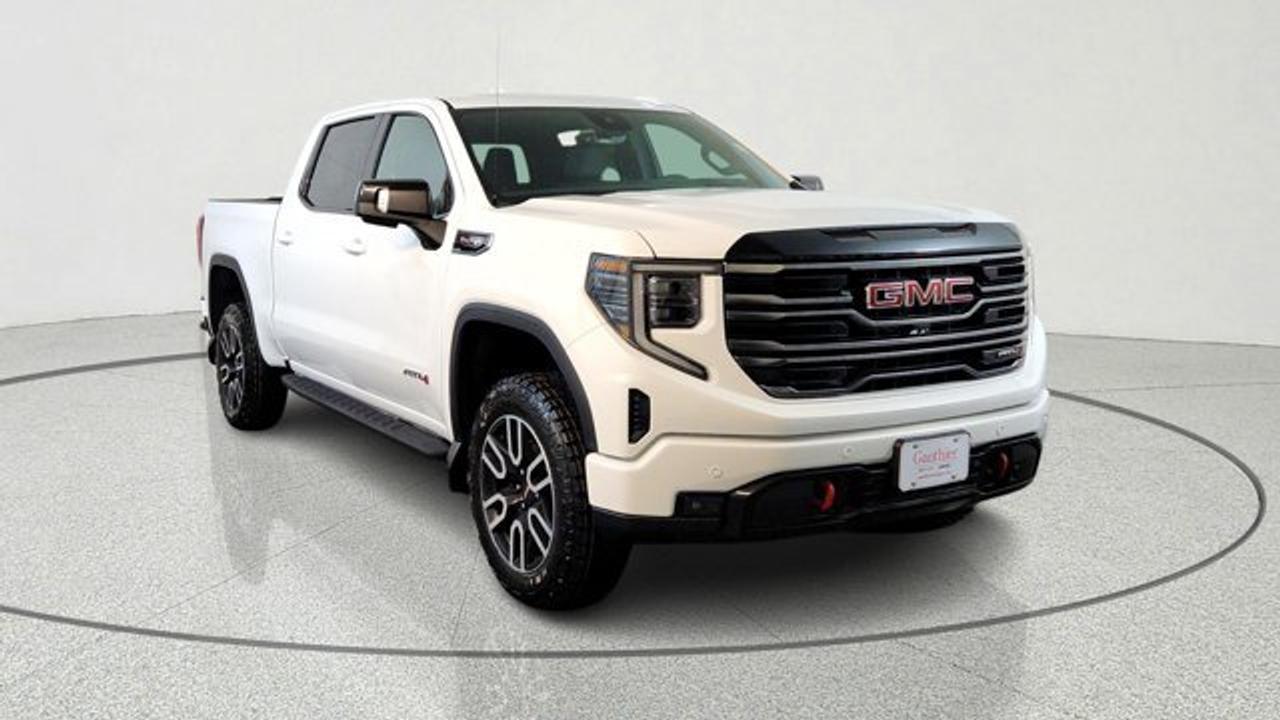 The 2026 GMC Sierra 1500 AT4 brings a serious dose of off-road capability to the full-sized pickup segment, featuring a factory-installed 2-inch suspension lift with off-road tuned components and Rancho monotube shocks. Under the hood it pairs the rugged 6.2 litre engine with a 10-speed automatic transmission. Inside, the cabin features premium touches like perforated leather front seats in Jet Black with Kalahari accents, and a 13.4-inch touchscreen infotainment system with Google Built-In.