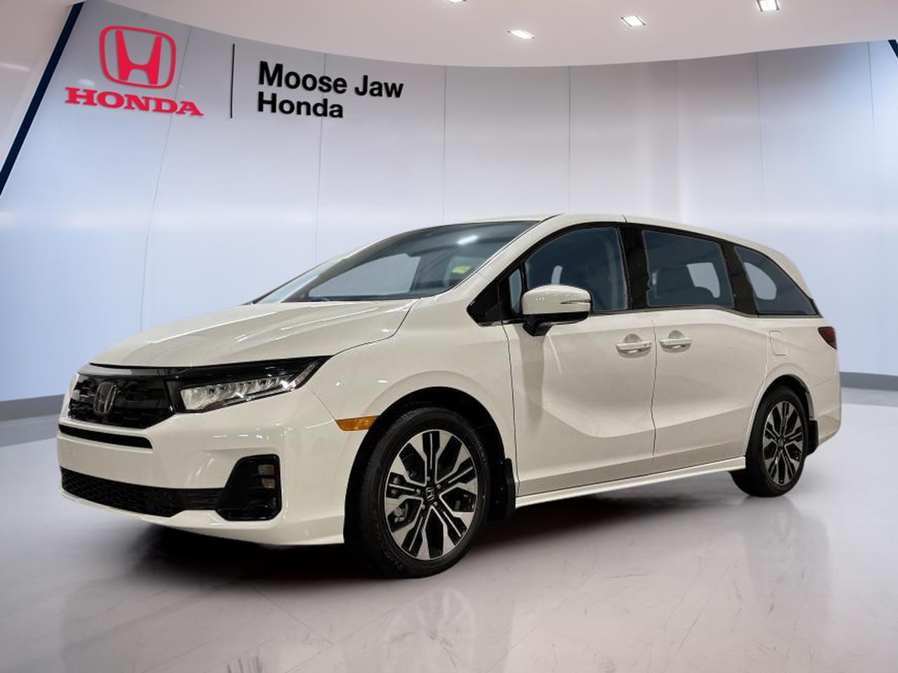 Meet the brand new 2026 Honda Odyssey Touring at Moose Jaw Honda in Moose Jaw, finished in clean White with a Black interior. This minivan is built for busy families who want an easy daily drive and a calm, confident feel on the highway. With a 10-speed automatic transmission (including shift capability) and front-wheel drive, its ready for Saskatchewan life.

Under the hood, the 2026 Honda Odyssey Touring uses a 3.5 L 24-valve direct-injection SOHC i-VTEC V6. It delivers smooth, quiet power for merging, passing, and loaded trips across town. The 10-speed automatic helps keep the drive refined, with well-spaced gears that make acceleration feel natural and steady. If you want a new minivan that feels composed and capable, this Odyssey Touring is a smart fit.

ADVANCED SAFETY FEATURES  
»» Front-wheel drive for confident daily traction  
»» Smooth shifting for controlled acceleration  
»» Stable handling feel in city traffic  
»» Predictable braking response for peace of mind  

PERFORMANCE AND EFFICIENCY  
»» 3.5 L i-VTEC V6 power  
»» Direct injection for crisp throttle response  
»» 10-speed automatic for smooth cruising  
»» Front-wheel drive for efficient packaging  

COMFORT AND CONVENIENCE  
»» Spacious minivan layout for family routines  
»» Easy driving position with clear sightlines  
»» Automatic transmission reduces driver workload  
»» Cabin finished in practical Black colour  

TECHNONOLGY AND CONNECTIVITY  
»» Shift-capable automatic transmission control  
»» Clear driver information while on the move  
»» Modern vehicle electronics for smooth operation  
»» Simple, driver-friendly controls and layout  

CARGO SPACE  
»» Minivan cargo area for daily errands  
»» Room for strollers, bags, and gear  
»» Practical space for sports and groceries  
»» Family-ready storage for road trip needs  

WHAT OTHER OWNERS LIKE  
»» Smooth V6 power for merging  
»» Calm ride quality on highways  
»» Minivan practicality for busy families  
»» Easy driving feel in traffic  

This 2026 Honda Odyssey Tourings VIN is: 5FNRL6H84TB501586.<p> finished in clean White with a Black interior. This minivan is built for busy families who want an easy daily drive and a calm</p>
<p> confident feel on the highway. With a 10-speed automatic transmission (including shift capability) and front-wheel drive</p>
<p> the 2026 Honda Odyssey Touring uses a 3.5 L 24-valve direct-injection SOHC i-VTEC V6. It delivers smooth</p>
<p> with well-spaced gears that make acceleration feel natural and steady. If you want a new minivan that feels composed and capable</p>
<p> this Odyssey Touring is a smart fit.

ADVANCED SAFETY FEATURES  
»» Front-wheel drive for confident daily traction  
»» Smooth shifting for controlled acceleration  
»» Stable handling feel in city traffic  
»» Predictable braking response for peace of mind  

PERFORMANCE AND EFFICIENCY  
»» 3.5 L i-VTEC V6 power  
»» Direct injection for crisp throttle response  
»» 10-speed automatic for smooth cruising  
»» Front-wheel drive for efficient packaging  

COMFORT AND CONVENIENCE  
»» Spacious minivan layout for family routines  
»» Easy driving position with clear sightlines  
»» Automatic transmission reduces driver workload  
»» Cabin finished in practical Black colour  

TECHNONOLGY AND CONNECTIVITY  
»» Shift-capable automatic transmission control  
»» Clear driver information while on the move  
»» Modern vehicle electronics for smooth operation  
»» Simple</p>
<p> driver-friendly controls and layout  

CARGO SPACE  
»» Minivan cargo area for daily errands  
»» Room for strollers</p>
<p> and gear  
»» Practical space for sports and groceries  
»» Family-ready storage for road trip needs  

WHAT OTHER OWNERS LIKE  
»» Smooth V6 power for merging  
»» Calm ride quality on highways  
»» Minivan practicality for busy families  
»» Easy driving feel in traffic  

This 2026 Honda Odyssey Tourings VIN is: 5FNRL6H84TB501586.</p>