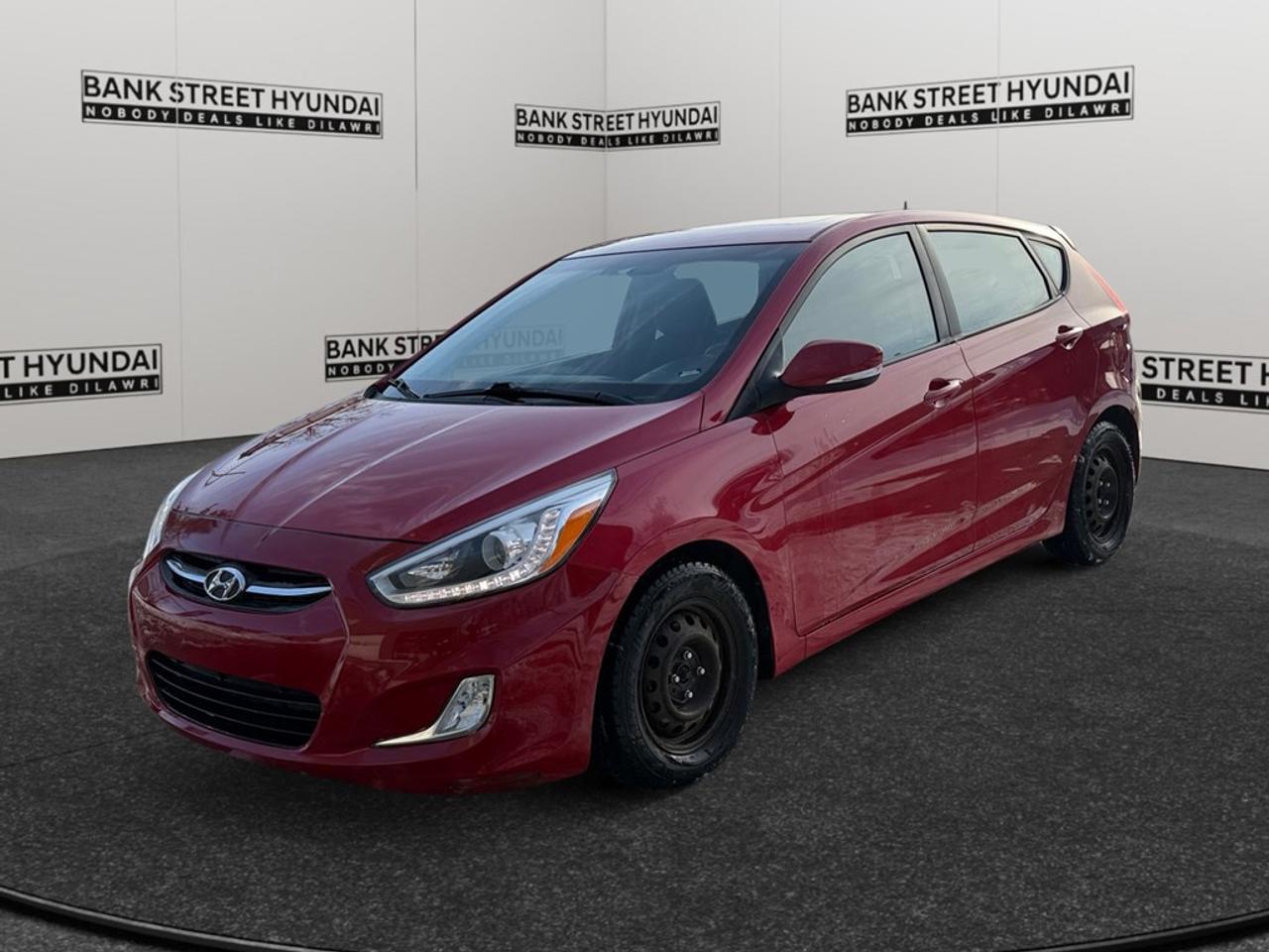 The 2016 Hyundai Accent GLS 5dr HB Auto invites you with its striking Red exterior and nimble FWD drivetrain, offering excellent handling and a smooth driving experience for urban adventures. This Hatchback stands out with its stylish alloy wheels and an appealing sunroof/moonroof that promises ample natural light and fresh air circulation. Inside, the heated front seats offer comfort on chilly days, while the elegant combination of leather and piano black on the gear shifter and steering wheel adds a touch of sophistication to the driving experience. With features like keyless entry and power windows, this Accent prioritizes ease and convenience. Stay connected with the integrated bluetooth connection and enjoy entertainment on the go with the satellite radio. Safety is addressed with the inclusion of brake assist, ensuring confidence in every drive. The vehicles practicality is enhanced by heated mirrors, ensuring clear visibility in adverse weather. The 2016 Hyundai Accent GLS is perfect for city dwellers and young professionals looking for a reliable and stylish ride. Contact us today to schedule a test drive and learn more about how this dynamic hatchback can complement your urban lifestyle.