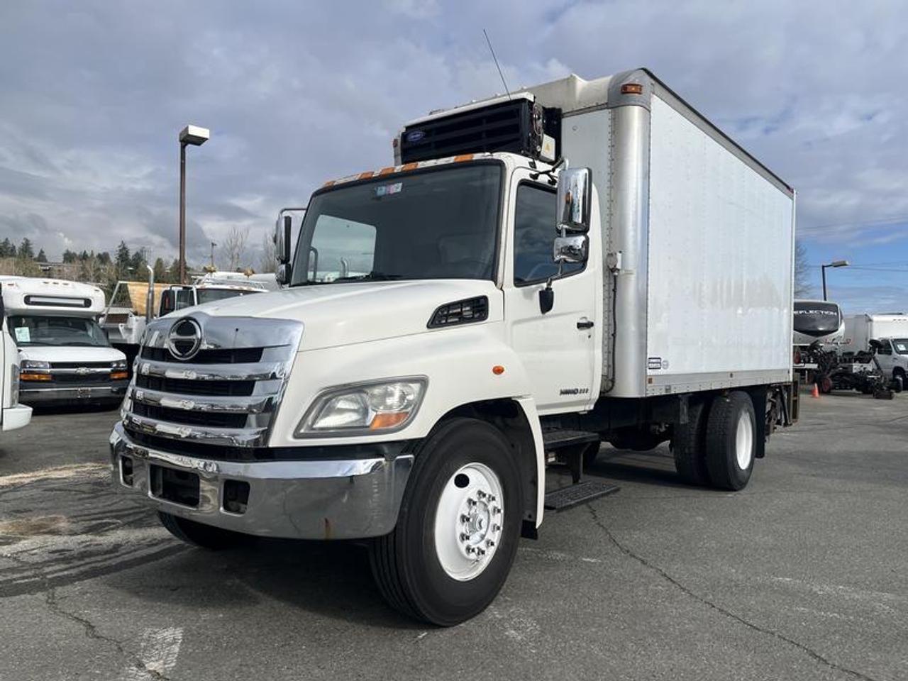 2012 Hino 268 Cube Van With Power Tailgate Diesel Reefer, Hydraulic Brakes, 7.6L L6 DIESEL engine, 6 cylinder, 2 door, automatic, cruise control, air conditioning, power door locks, power windows, white exterior, black interior. Box Length - 185 inches, Box Width-91 inches.  $22,310.00 plus $375 processing fee, $22,685.00 total payment obligation before taxes.   Listing report, warranty, contract commitment cancellation fee, financing available on approved credit (some limitations and exceptions may apply). All above specifications and information is considered to be accurate but is not guaranteed and no opinion or advice is given as to whether this item should be purchased. We do not allow test drives due to theft, fraud, acts of vandalism and undetectable impaired driving. Instead we provide the following benefits: Complimentary Warranty (with options to extend), Limited Money Back Satisfaction Guarantee on Fully Completed Contracts, Contract Commitment Cancellation, and an Open-Ended Sell-Back Option. Ask seller for details or call 604-522-REPO(7376) to confirm listing availability.