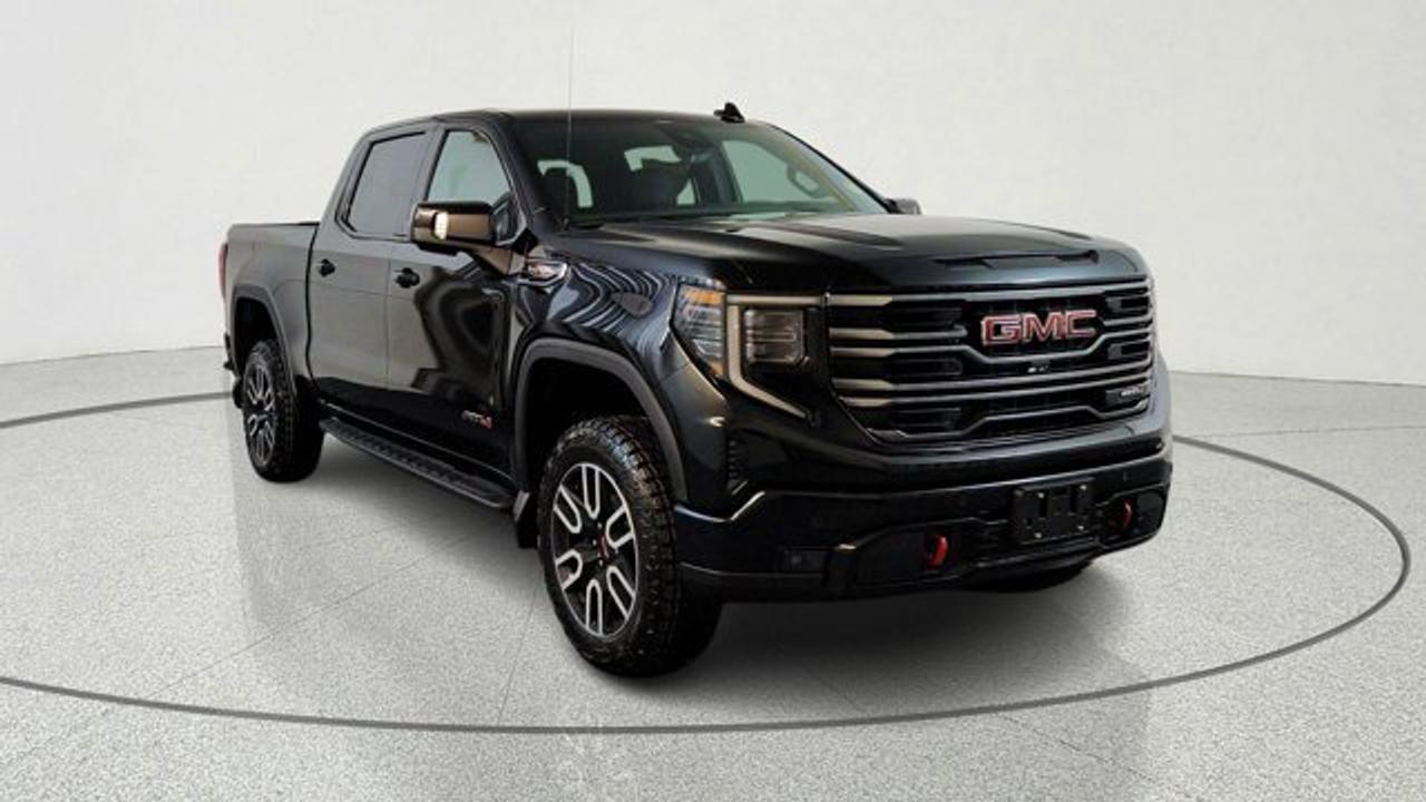 The 2026 GMC Sierra 1500 AT4 brings a serious dose of off-road capability to the full-sized pickup segment, featuring a factory-installed 2-inch suspension lift with off-road tuned components and Rancho monotube shocks. Under the hood it pairs the rugged 6.2 litre engine with a 10-speed automatic transmission. Inside, the cabin features premium touches like perforated leather front seats in Jet Black with Kalahari accents, and a 13.4-inch touchscreen infotainment system with Google Built-In.