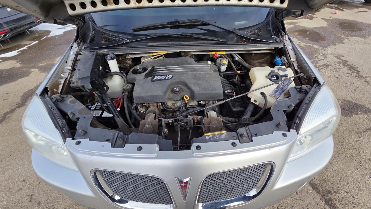 2008 Pontiac Montana w/1SB, DRIVES GREAT, RUSTY UNDERCARRIAGE, AS IS Photo