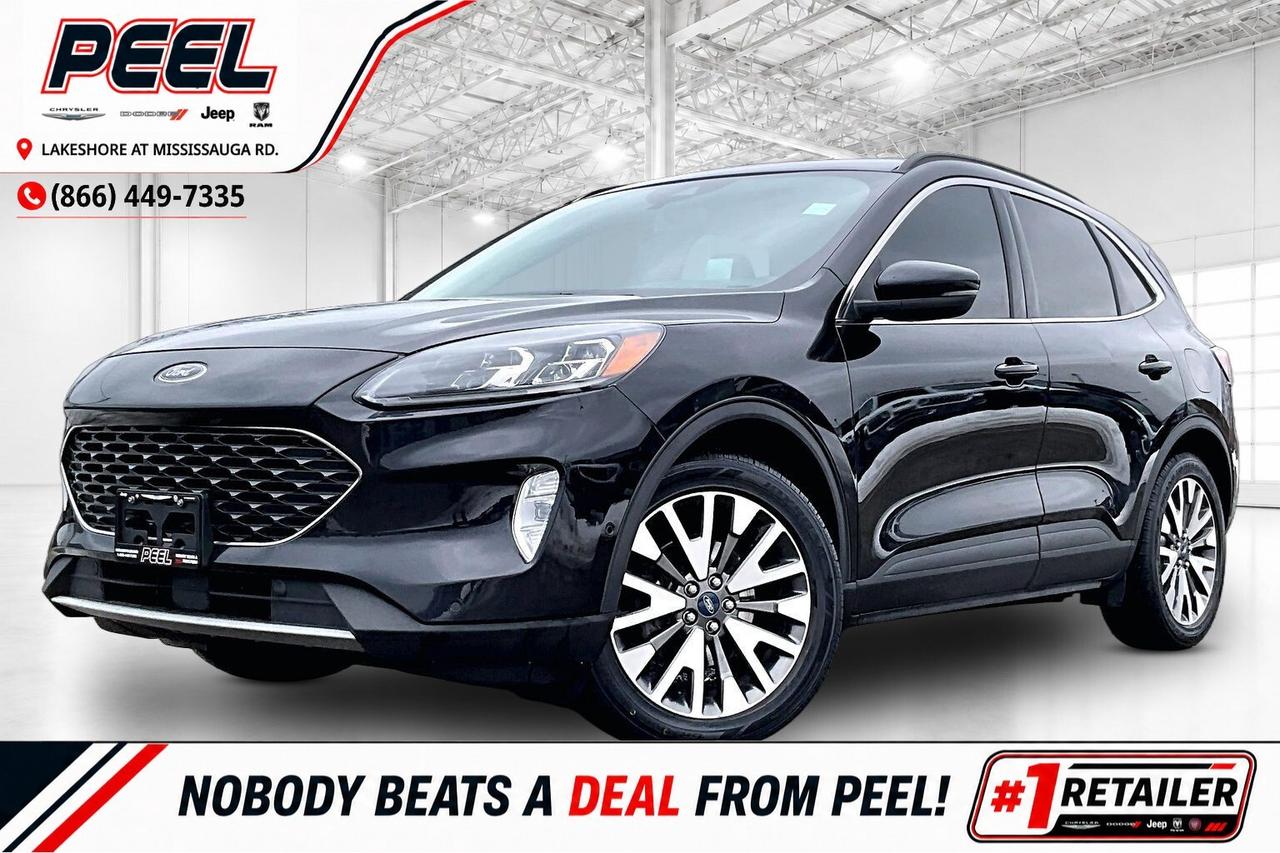 COME SEE WHY NOBODY BEATS A DEAL FROM PEEL! Your Source for ALL make and models used cars and trucks.

2020 Ford Escape Titanium AWD | 2.0L EcoBoost I-4 Engine | Agate Black Metallic | Titanium Premium Package | 401A Equipment Group | Heated Leather Seats | Ford SYNC3 Touchscreen Display | Panoramic Vista Roof | Bang & Olufsen High Performance Audio System | Heated Steering Wheel | Remote Start | Class II Trailer Tow Package | Lane Keep Assist | Forward Collision Warning | Blind Spot Monitoring | Dual-zone Automatic Climate Control | Winter Tires on Steel Wheels Included (As Is)

If you want a compact SUV that feels genuinely upscale but still ready for Canadian seasons, this 2020 Ford Escape Titanium AWD in Agate Black Metallic nails it with the punchy 2.0L EcoBoost making 250 hp and 280 lb-ft of torque for quick, confident passing and effortless highway cruising. Settle into heated leather seats with dual-zone automatic climate control, fire it up with remote start, and enjoy the open, airy feel of the panoramic Vista Roof while SYNC 3 keeps navigation, calls, and music intuitive, all backed by a Bang and Olufsen sound system as part of the Titanium Premium Package. Lane Keep Assist, Forward Collision Warning, and Blind Spot Monitoring add peace of mind in traffic and on long drives. Equipped with the Class II Trailer Tow Package for up to 3,500 lb when properly configured, plus winter tires on steel wheels included as-is, this Titanium is a rare blend of performance, luxury, and real-world utility.
______________________________________________________

FREE CarFax included! Click the CarFax link in the listing to view the report.

Our advertised prices are for consumers/end users only and are not intended for dealer, wholesale, exporter, or broker purchases.
______________________________________________________

Peel Chrysler is based in Port Credit, Mississauga, and proudly serves customers across Ontario and Canada, including Toronto, Oakville, North York, Richmond Hill, Ajax, Hamilton, Niagara Falls, Brampton, Scarborough, Vaughan, London, Windsor, Cambridge, Kitchener, Waterloo, Brantford, Sarnia, Pickering, Huntsville, Milton, Woodbridge, Aurora, Newmarket, Orangeville, Georgetown, Markham, North Bay, Sudbury, Barrie, Oshawa, Kingston, Innisfil, and surrounding areas. Browse our selection of used cars, trucks, SUVs, vans, Ram, Jeep, Dodge, Chrysler, FIAT, and all makes and models at peelchrysler.com.
______________________________________________________

Disclaimer: Prices are for consumer/end-user purchases only. Advertised prices are all-in and include all dealer fees and charges, including the $499 loan processing fee where applicable, except HST, Fuel and Licensing, unless otherwise stated. Payments, rates, and terms are subject to approved credit and may change without notice. If a trade-in has an outstanding loan balance and Peel Chrysler is required to facilitate the lien payout, a $349 lien payout fee applies. Most pre-owned vehicles originally come with two keys; however, all Peel Chrysler pre-owned vehicles come standard with one key unless otherwise stated. Vehicle images may be digitally adjusted or enhanced for presentation purposes and may not always reflect the exact appearance of the vehicle. While we make every effort to ensure accuracy, vehicle details, features, options, materials, history, specifications, pricing, availability, and CarFax information should be verified with Peel Chrysler before purchase.