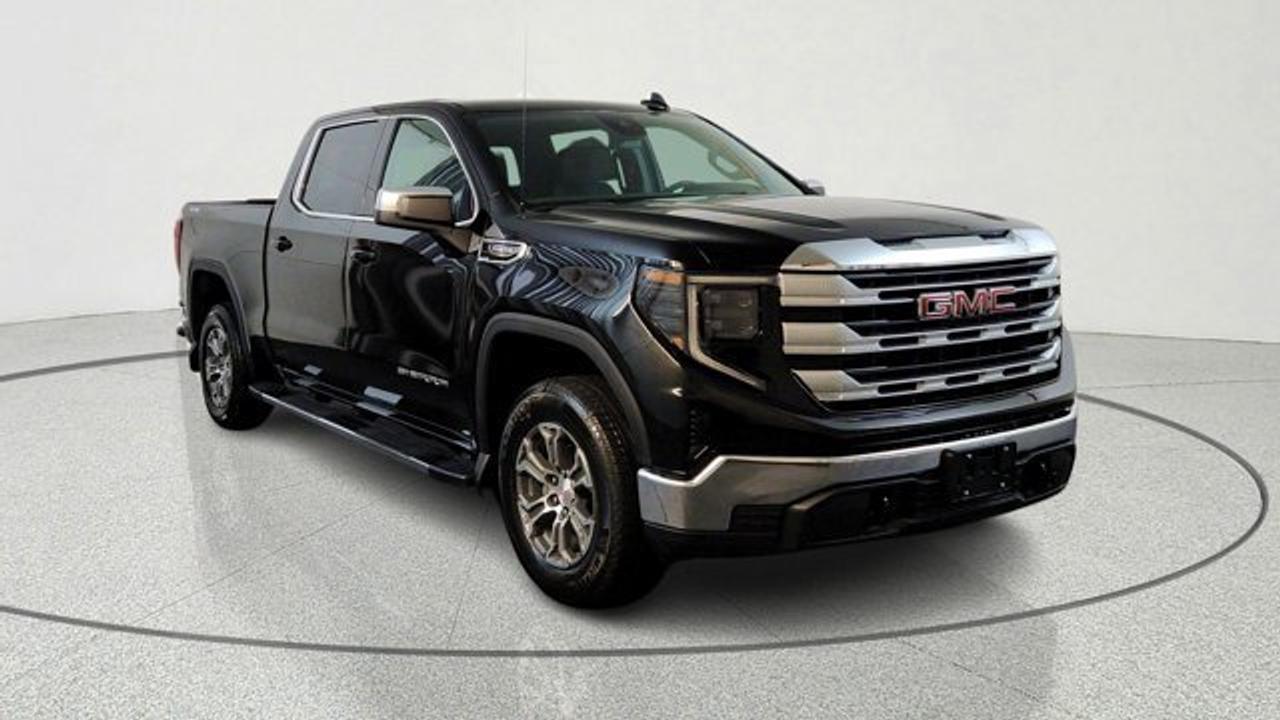 The 2026 GMC Sierra 1500 SLE is a mid-level full-size pickup that combines comfort, technology, and capability in a versatile package. It comes standard with a large 13.4-inch multicolor touchscreen infotainment system paired with a 12.3-inch driver information display, plus upgraded interior comforts like a 10-way power heated driver seat with lumbar support, the MultiPro tailgate, heated front passenger seat, and a heated steering wheel for enhanced everyday usability. On the capability side, the SLE adds an auto-locking rear differential for improved traction and is powered by a 5.3 litre V8 engine for strong towing performance, while features like available spray-on bedliner help protect the cargo area.