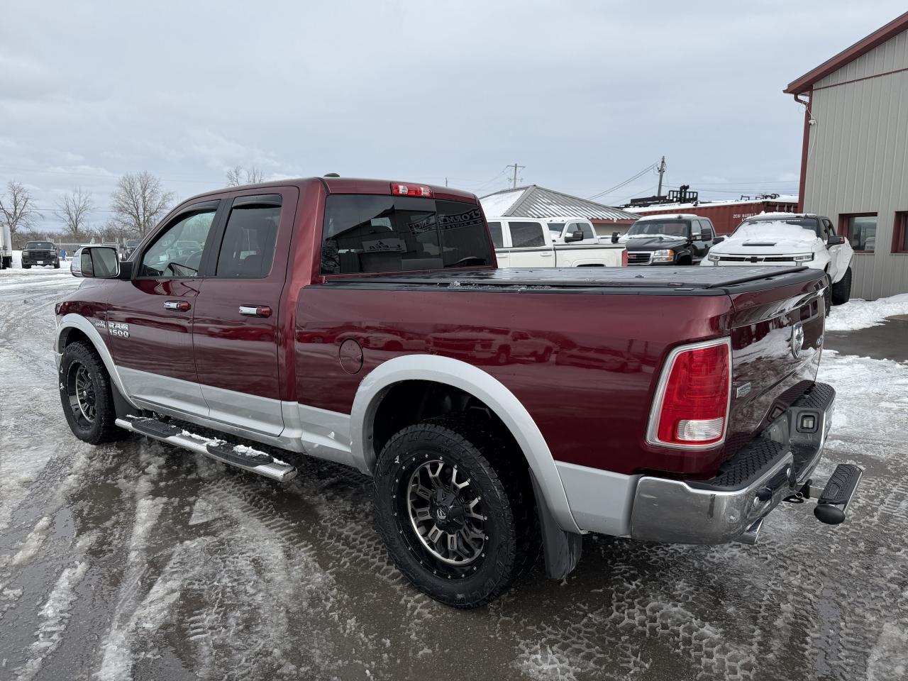 2017 RAM 1500 4WD Quad Cab 140.5  Laramie Photo4