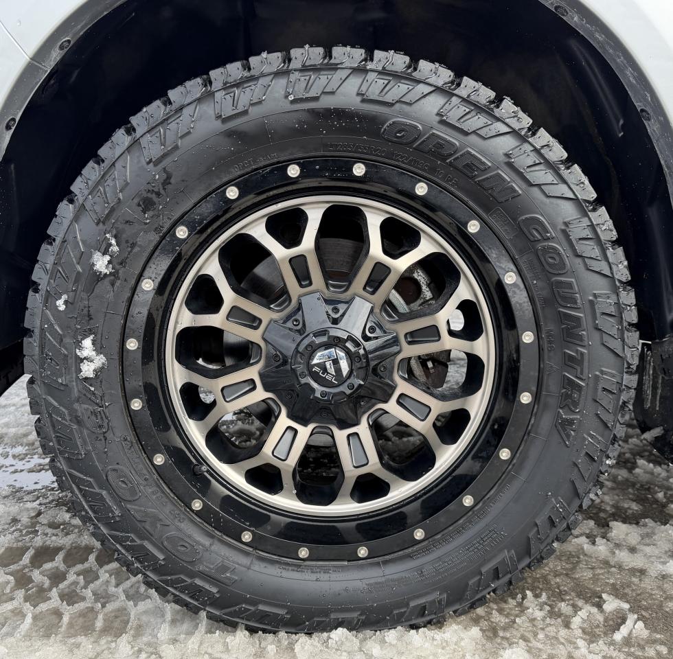 2017 RAM 1500 4WD Quad Cab 140.5  Laramie Photo