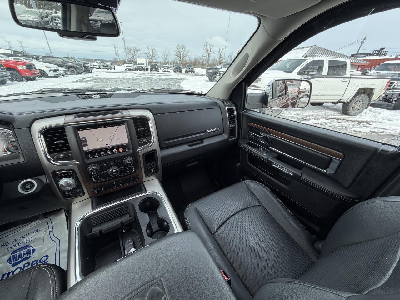 2017 RAM 1500 4WD Quad Cab 140.5  Laramie Photo