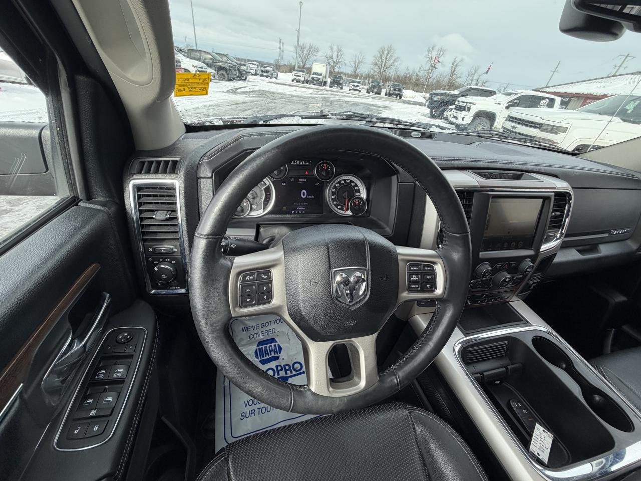 2017 RAM 1500 4WD Quad Cab 140.5  Laramie Photo