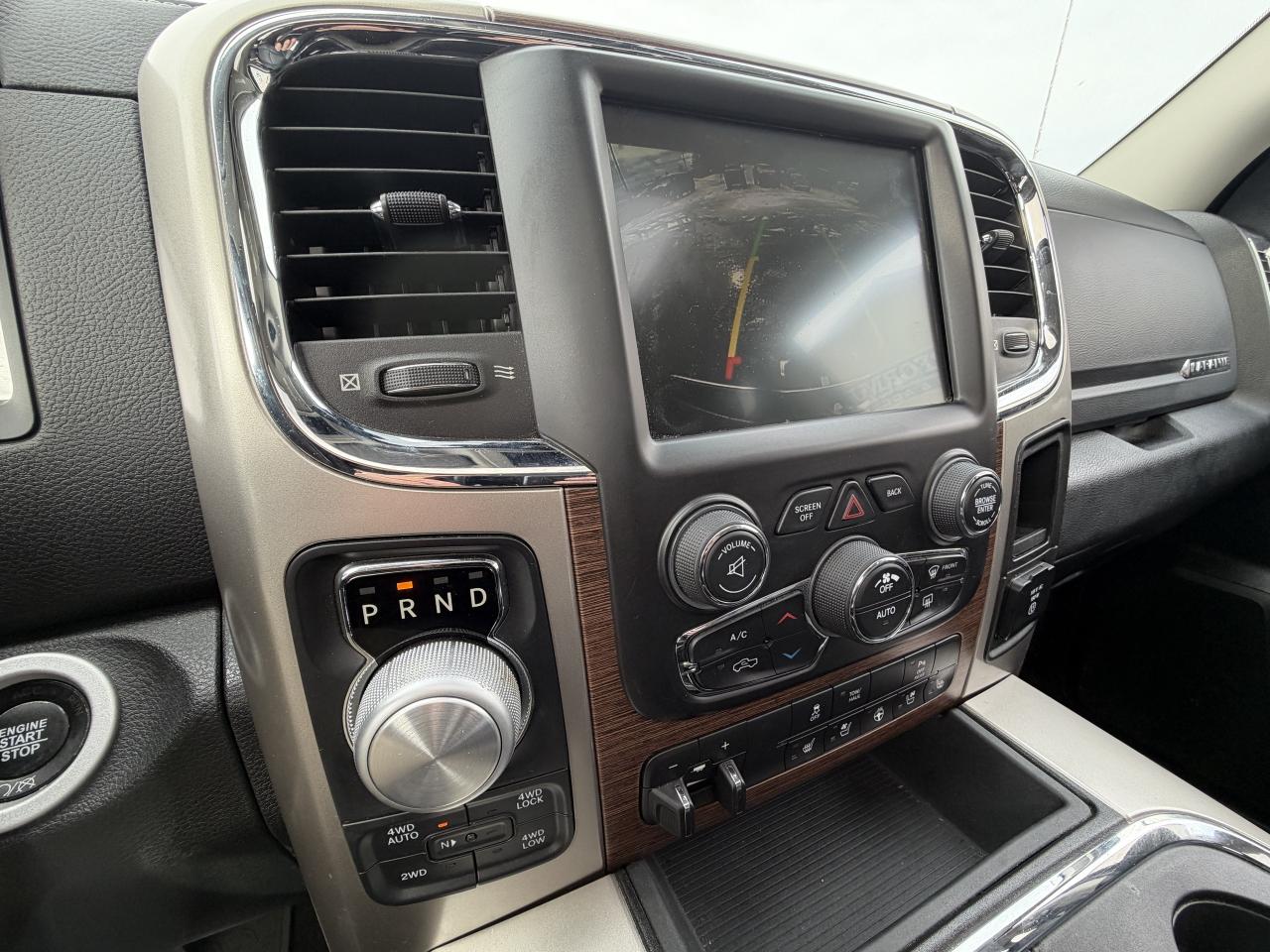 2017 RAM 1500 4WD Quad Cab 140.5  Laramie Photo