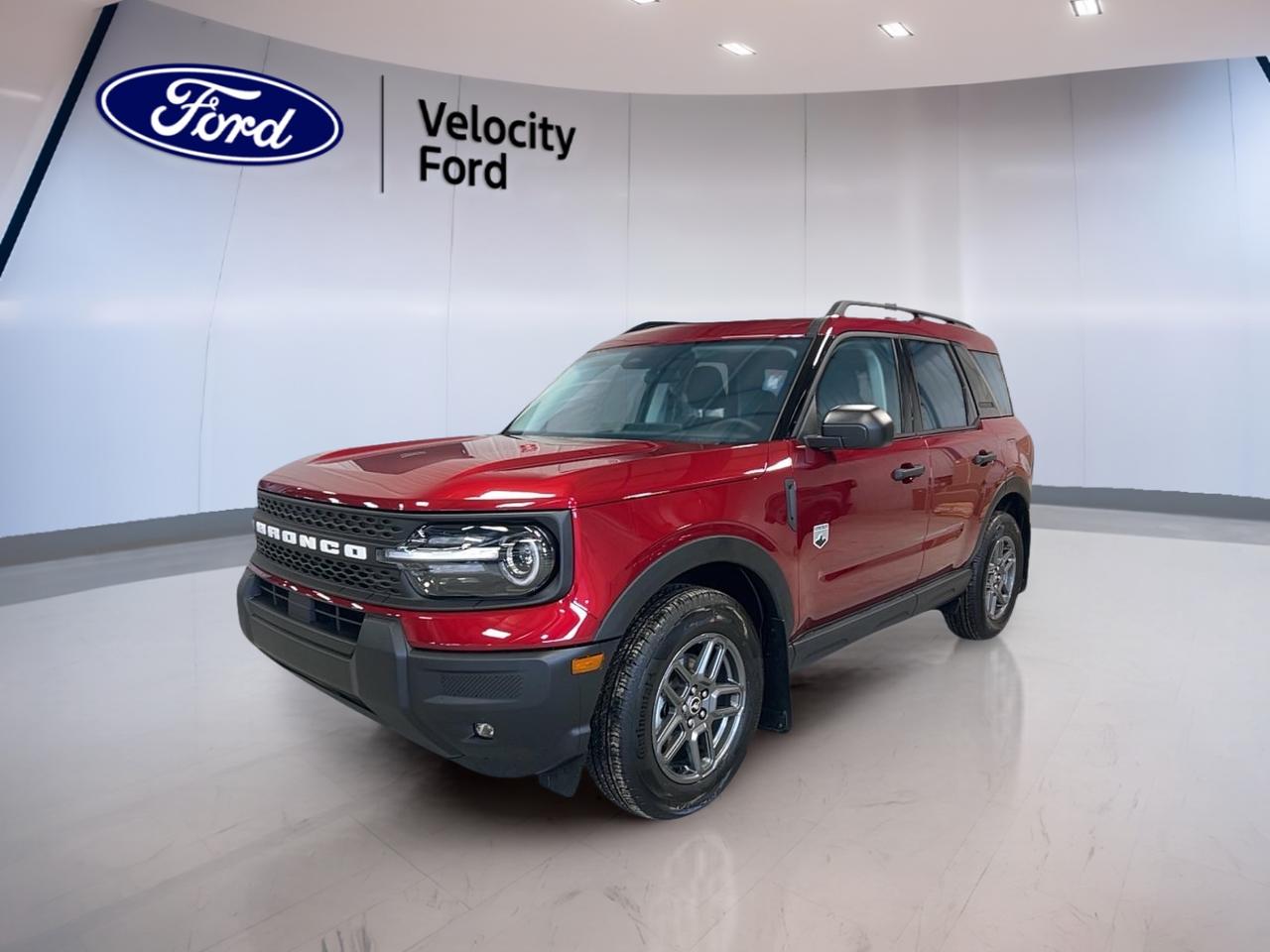 Meet the brand new 2026 Ford Bronco Sport Big Bend, now at Velocity Ford in Moose Jaw. Finished in a bold red exterior with a warm brown interior, this 4-door SUV is built for drivers who want everyday comfort with real all-weather confidence. With a 1.5-litre gas engine and an 8-speed automatic transmission, it delivers smooth, easy power for city commutes and weekend escapes. Add in capable Four-Wheel Drive, and youre ready for changing Prairie roads, gravel routes, and winter mornings without second thoughts.

Inside, the 2026 Ford Bronco Sport Big Bend keeps life simple and comfortable. You get automatic climate control and front air conditioning to help keep the cabin steady in every season. Heated front seats and heated mirrors are a welcome touch when temperatures drop. The drivers seat lumbar support and drivers side power seat help you settle in for longer drives, while the adjustable steering wheel makes it easy to find the right position.

Daily driving is also made easier with practical tech. Push button start gets you moving quickly, and power windows plus power steering keep everything light and effortless. Tinted windows add comfort and privacy, while ambient lighting adds a clean, modern feel at night. For entertainment and convenience, youll appreciate satellite radio, Bluetooth integration, steering wheel audio controls, and a built-in WiFi hotspot for connected trips.

When its time to park or back into a tight spot, the backup camera and automatic headlights help reduce stress. Youll also benefit from a strong set of safety essentials, including Anti-Lock Braking System (ABS), stability control, and a full array of airbags. Lane departure warning and a blind spot monitor add extra awareness for highway driving, while child safety locks support family-friendly peace of mind.

FEATURES OF THE Bronco Sport Big Bend  
»» Four-Wheel Drive for confident traction  
»» Heated front seats for cold days  
»» Push button start for quick getaways  
»» Automatic climate control for steady comfort  

ADVANCED SAFETY FEATURES  
»» Anti-Lock Braking System for controlled stops  
»» Blind spot monitor for safer lane changes  
»» Lane departure warning adds driver awareness  
»» Backup camera helps with reversing  

PERFORMANCE AND EFFICIENCY  
»» 1.5-litre gas engine for daily driving  
»» 8-speed automatic transmission shifts smoothly  
»» Four-Wheel Drive for changing road conditions  
»» Stability control helps maintain traction  

COMFORT AND CONVENIENCE  
»» Heated front seats for winter comfort  
»» Driver lumbar support reduces fatigue  
»» Power windows for quick ventilation  
»» Automatic door locks add everyday ease  

TECHNONOLGY AND CONNECTIVITY  
»» Bluetooth integration for hands-free calling  
»» Steering wheel audio controls keep focus  
»» Satellite radio for more listening choice  
»» WiFi hotspot helps keep devices connected  

CARGO SPACE  
»» Rear trunk access for easy loading  
»» Four-door layout improves daily usability  
»» Practical space for errands and gear  
»» Convenient cabin storage for small items  

WHAT OTHER OWNERS LIKE  
»» Confident visibility from SUV seating position  
»» Helpful driver-assist features for commuting  
»» Easy-to-use infotainment and phone pairing  
»» Sure-footed feel in poor weather  

This 2026 Ford Bronco Sport Big Bends VIN is: 3FMCR9BN3TRE05074.