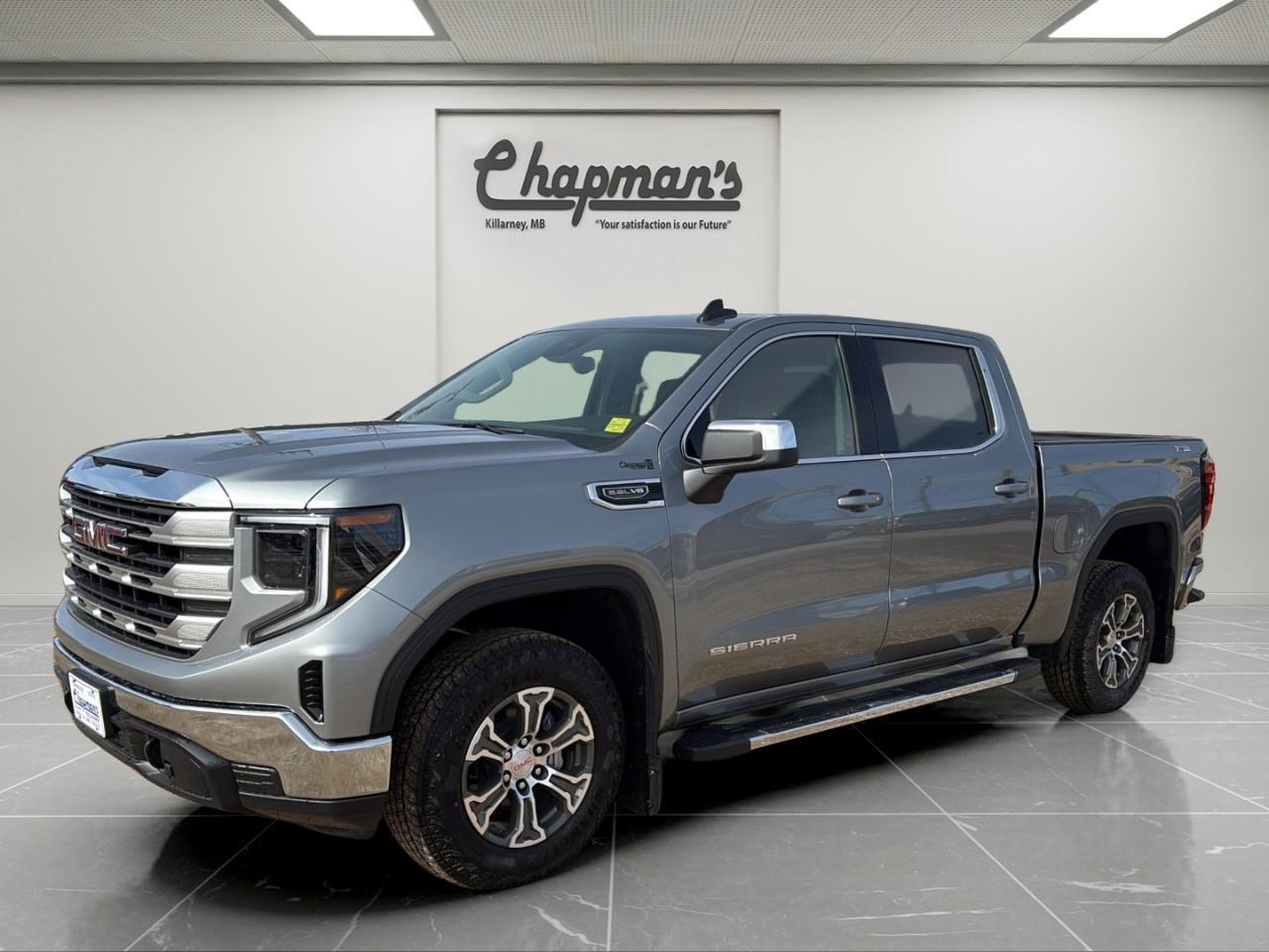 <p>Strong V8 performance meets modern truck technology in this <strong>2026 GMC Sierra 1500 SLE Crew Cab 4WD</strong>, finished in <strong>Sterling Metallic with a Jet Black interior</strong>. Built for drivers who need dependable capability with everyday comfort, this Sierra delivers proven power, advanced tech, and practical versatility.</p><p>Under the hood, the <strong>5.3L EcoTec3 V8 engine paired with a 10-speed automatic transmission</strong> provides confident acceleration, smooth shifting, and excellent towing capability. Equipped with a <strong>factory trailering package, trailer brake controller, and auto-locking rear differential</strong>, this truck is ready for work, hauling, and weekend towing.</p><p>Inside, the Sierra SLE offers a well-appointed and functional cabin with <strong>heated front seats, a heated steering wheel, dual-zone climate control, and a versatile 40/20/40 front bench seat with underseat storage</strong>. The large <strong>13.4" touchscreen with Google built-in and 12.3" digital driver display</strong> bring modern connectivity and convenience to every drive.</p><h3><strong>Performance & Capability</strong></h3><p>V8 power and proven capability for work and play.</p><ul><li><p>5.3L EcoTec3 V8 Engine</p></li><li><p>10-Speed Automatic Transmission</p></li><li><p>4WD Capability</p></li><li><p>Auto-Locking Rear Differential</p></li><li><p>Trailering Package</p></li><li><p>Trailer Brake Controller</p></li><li><p>Hill Start Assist & Trailer Sway Control</p></li><li><p>120V Power Outlets (Bed & Cabin)</p></li></ul><h3><strong>Interior Comfort & Convenience</strong></h3><p>Functional and comfortable interior built for daily use.</p><ul><li><p>Heated Front Seats</p></li><li><p>Heated Leather-Wrapped Steering Wheel</p></li><li><p>10-Way Power Driver Seat</p></li><li><p>Dual-Zone Automatic Climate Control</p></li><li><p>40/20/40 Front Bench Seat with Armrest</p></li><li><p>Rear 60/40 Folding Bench Seat</p></li><li><p>Remote Vehicle Start</p></li><li><p>Keyless Open & Start</p></li></ul><h3><strong>Technology & Connectivity</strong></h3><p>Modern GMC tech with seamless integration.</p><ul><li><p>13.4" Infotainment Touchscreen with Google Built-In</p></li><li><p>Wireless Apple CarPlay</p></li><li><p>Wireless Android Auto</p></li><li><p>12.3" Digital Driver Information Centre</p></li><li><p>OnStar Basics (Up to 8 Years)</p></li><li><p>SiriusXM Capability</p></li></ul><h3><strong>Safety & Driver Assistance</strong></h3><p>Standard GMC Pro Safety features for added confidence.</p><ul><li><p>Automatic Emergency Braking</p></li><li><p>Forward Collision Alert</p></li><li><p>Lane Keep Assist with Lane Departure Warning</p></li><li><p>Front Pedestrian Braking</p></li><li><p>Following Distance Indicator</p></li><li><p>IntelliBeam Automatic High Beams</p></li><li><p>HD Rear Vision Camera</p></li><li><p>Teen Driver Mode</p></li></ul><h3><strong>Exterior Highlights</strong></h3><p>Clean, bold styling with practical truck features.</p><ul><li><p>Sterling Metallic Exterior</p></li><li><p>LED Headlamps & Daytime Running Lamps</p></li><li><p>EZ Lift Power Lock & Release Tailgate</p></li><li><p>LED Cargo Bed Lighting</p></li><li><p>Power Heated Exterior Mirrors</p></li></ul><p>With strong V8 performance, advanced infotainment technology, practical interior design, and proven GMC capability, this <strong>2026 Sierra 1500 SLE</strong> is a well-rounded truck built to handle both work and everyday driving with ease.</p><p>2 Year/24,000 kilometer* Complimentary Oil Changes (2 total)</p><p>3 Year/60,000 kilometer* Base Warranty Coverage</p><p>5 Year/100,000 kilometer* Powertrain Component Warranty Coverage</p><p>5 Year/100,000 kilometer* Courtesy Transportation and 24/7 Roadside Assistance</p><p>6 Year/160,000 kilometer* Sheet Metal (Rust Through) Perforation Warranty Coverage</p><p>*Whichever Comes First.</p><p>Price Includes HD Flaps & 6 Tube Steps.</p><p>Price Includes Dealer Fee.</p><p>Price Excludes PST & GST.</p><p>Financing Options Available, Call For More Details.</p> <p><strong>*While every reasonable effort is made to ensure the accuracy of this information, we are not responsible for any error or omissions contained on these pages. Please verify any information in question with Chapman Motors Ltd.</strong></p>