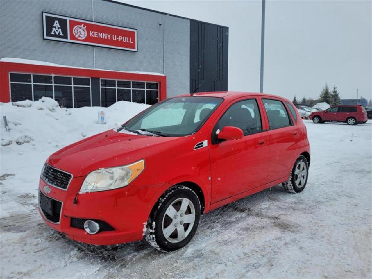 2009 Chevrolet Aveo in Sport Red. The vehicle has 158,054km. The vehicle runs and drives ok. The body has multiple rust spots. Rockers are rusted. Check engine light on. Vehicle might need a break job. Slight vibrations felt in the engine bay/ within the cabin. We dont perform any mechanical/safety inspections. The vehicle is sold as is and might need some work.
