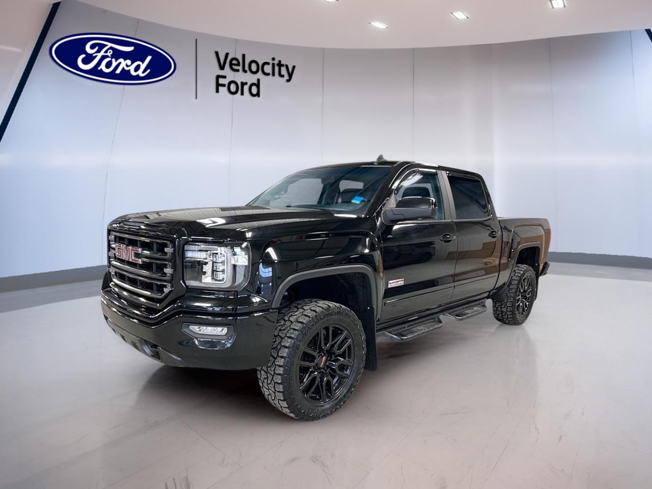// ACCIDENT FREE!! //

Meet the 2017 GMC Sierra 1500 SLT Crew Cab, now at Velocity Ford in Moose Jaw. Finished in black and showing 196,061 km, this 4-door truck brings the comfort you want and the capability you need. CARFAX Canada reports no accidents.

TRUCK FEATURES  
»» Towing capacity rated up to 5,306 kg  
»» Four-Wheel Drive for confident traction  
»» Limited slip differential for better grip  
»» Rear tow hook for recovery support  

ADVANCED SAFETY FEATURES  
»» Anti-Lock Braking System for controlled stops  
»» Stability Control helps maintain steady handling  
»» Driver airbag and passenger airbag included  
»» Side impact airbags for added protection  

PERFORMANCE AND EFFICIENCY  
»» 5.3 L gas engine for strong power  
»» 6-speed automatic transmission for smooth shifts  
»» Power steering for easy low-speed control  
»» Cruise control helps on long drives  

COMFORT AND CONVENIENCE  
»» Dual-zone automatic climate control for comfort  
»» Heated front seats for cold mornings  
»» Power windows for quick ventilation  
»» Remote starter for easier winter starts  

TECHNONOLGY AND CONNECTIVITY  
»» Navigation system helps plan every route  
»» Bluetooth integration for hands-free calling  
»» Steering wheel audio controls within easy reach  
»» WiFi hotspot helps keep you connected  

CARGO SPACE  
»» Rear trunk access for in-cab storage  
»» Spare tire onboard for roadside confidence  
»» Tinted windows help reduce cabin heat  
»» Retractable mirrors help in tight spaces  

WHAT OTHER OWNERS LIKE  
»» Confident feel from Four-Wheel Drive  
»» Strong V8 power for daily tasks  
»» Comfortable ride for long highway trips  
»» Useful tech like Bluetooth and navigation  

This Sierra 1500 SLT Crew Cab is set up for real Canadian driving. The HID headlights and fog lights help you see clearly when the weather turns, while heated mirrors and turn signal mirrors add day-to-day convenience. A backup camera supports safer reversing in busy lots or tight driveways.

Inside, this truck is built to make long days easier. You get front air conditioning plus dual-zone climate control, along with an auto-dimming rearview mirror and ambient lighting for a calmer cabin at night. Memory seats, power driver and passenger seats, plus lumbar support for both front occupants help you settle in quickly.

For entertainment and information, you have satellite radio and HD Radio, with audio controls right on the steering wheel. The system also includes a navigation system and Bluetooth integration, helping you stay on track and in touch. Tire pressure monitoring adds another layer of everyday awareness.

If youre shopping for a used full-size truck in Moose Jaw, this black 2017 GMC Sierra 1500 SLT Crew Cab at Velocity Ford delivers the right mix of towing strength, 4WD confidence, and comfort-focused features, backed by an accident-free CARFAX Canada report.

This 2017 GMC Sierra 1500 SLT Crew Cabs VIN is: 3GTU2NEC8HG316149.