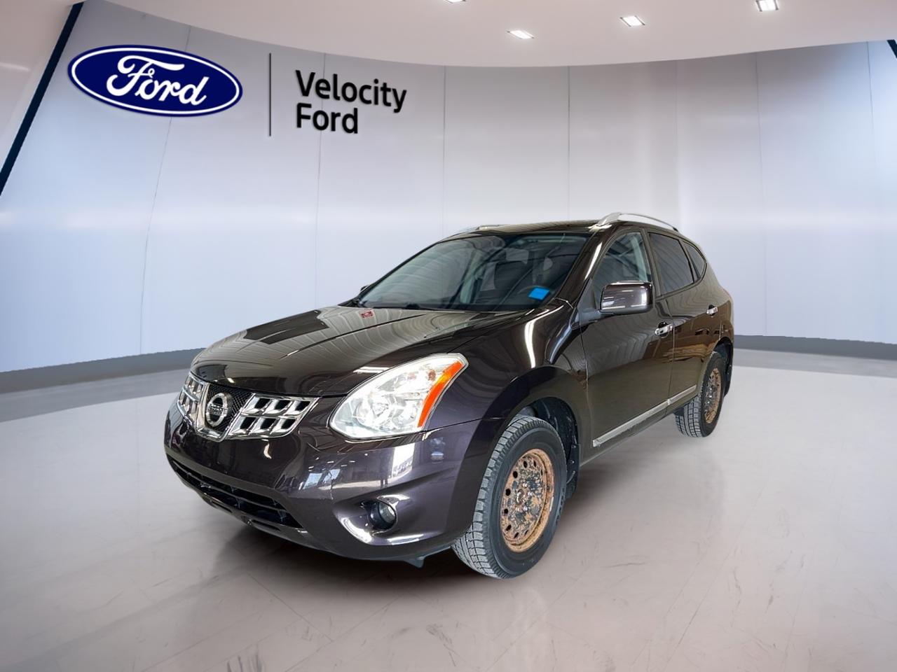 // ACCIDENT FREE!! //

Meet a smart, practical SUV that fits life in Moose Jaw. This 2013 Nissan Rogue SV AWD is a confident choice for daily driving, errands, and weekend plans. CARFAX Canada reports no accidents, and it shows in how clean and well kept it feels.

Finished in Black with 4 doors, this used Rogue SV AWD brings all-wheel drive peace of mind for changing Prairie weather. With 95,629km, it offers a great balance of proven reliability and plenty of road ahead. The 2.5 L gas engine and automatic transmission keep things simple and easy to live with.

FEATURES OF THE Rogue SV AWD  
»» All-wheel drive for year-round traction  
»» 2.5 L gas engine power  
»» Automatic transmission with CVT design  
»» Rear spoiler adds sporty finishing touch  

ADVANCED SAFETY FEATURES  
»» Anti-lock braking system for controlled stops  
»» Stability control helps maintain road grip  
»» Driver and passenger airbags included  
»» Side impact and head airbags  

PERFORMANCE AND EFFICIENCY  
»» 2.5 L gas engine for daily use  
»» Continuously variable transmission for smooth driving  
»» Power steering for easy city turns  
»» Tire pressure monitoring helps prevent wear  

COMFORT AND CONVENIENCE  
»» Automatic climate control maintains cabin comfort  
»» Front air conditioning for summer relief  
»» Heated front seats for cold days  
»» Drivers seat lumbar support included  

TECHNONOLGY AND CONNECTIVITY  
»» Backup camera helps with reversing  
»» Steering wheel audio controls included  
»» Power windows for quick ventilation  
»» Illuminated vanity mirrors front passengers  

CARGO SPACE  
»» Rear trunk access makes loading simple  
»» Cargo cover helps keep items hidden  
»» Spare tire included for peace of mind  
»» Rear window defroster clears visibility fast  

WHAT OTHER OWNERS LIKE  
»» Confident all-wheel drive in winter  
»» Smooth CVT feel in traffic  
»» Useful cargo area for daily errands  
»» Heated seats for Canadian mornings  

This Rogue SV AWD is also equipped with practical exterior touches like tinted windows, heated mirrors, and electric mirrors to help with visibility in changing conditions. Added convenience items like automatic door locks, child safety locks, and a passenger airbag sensor help make every trip feel more secure and family friendly.

If you want a compact SUV thats easy to drive, easy to park, and ready for four-season roads, this 2013 Nissan Rogue SV AWD at Velocity Ford in Moose Jaw deserves a closer look.

This 2013 Nissan Rogue SV AWDs VIN is: JN8AS5MV4DW136706.