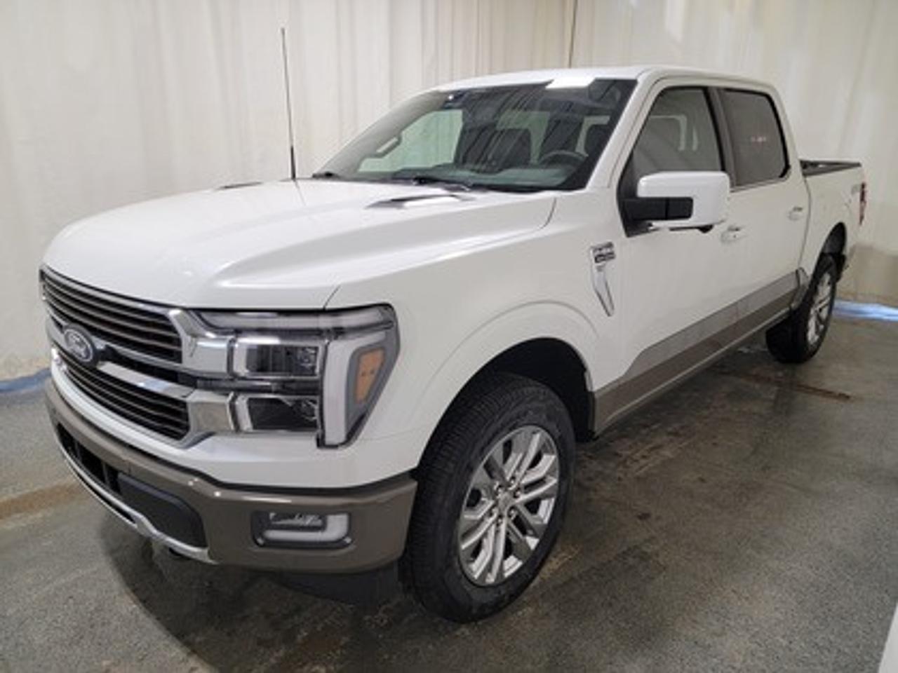 The all-new 2026 Ford F-150 King Ranch is presented in Star White Metallic Tri-Coat. Under the hood, it features the 3.5L EcoBoost engine, delivering an impressive 400 horsepower and 500 lb-ft of torque. Paired with a 10-speed automatic transmission, this truck provides both efficiency and power, achieving a combined fuel economy of 12.3L/100km (23 miles per gallon). 

Key Features:
Power-Deployable Running Boards
Unique Genuine Wood Interior Trim Accents
Heated Rear Seats
Heated Leather Wrapped Steering Wheel
Bed Utility Package
BlueCruise
Power Tilt/Telescoping with Memory Steering Column
Tow/Haul Package
Power Tilt/Telescopic Steering Column
14 Speaker B&O Sound System
Mobile Office Package
Engine Block Heater
Twin Panel Moonroof

This vehicle comes with the All-Weather Packageready to take on any season!
Snow, rain, mud, or sunshinethis vehicle is built for it all! The All-Weather Package adds extra protection where it matters most, with premium mud flaps to shield your paint from road debris, all-weather floor mats to protect your interior from lifes messes, and Xpel paint protection to help guard against those infuriating rock chips. Drive with confidence, knowing your investment is protected from Regina's elements.
 
Bennett Dunlop Ford, proudly serving Regina for over 40 years, is conveniently located at 770 Broad Street. With over 3,500 Google reviews, our reputation reflects our commitment to providing a fast, easy, and enjoyable vehicle-buying experience. We eliminate the hassle with no admin or documentation fees, transparent upfront pricing that lets you shop with total confidence. But were more than just a dealershipwere driven to make a difference by supporting local community initiatives and events that matter to you. Visit Bennett Dunlop Ford today and experience why were Reginas trusted choice for quality vehicles, exceptional service, and a genuine commitment to driving change in our community!