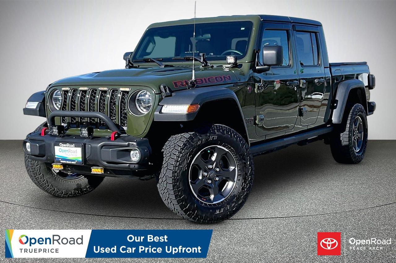 The 2021 Jeep Gladiator Rubicon 4x4 EcoDiesel pairs a turbocharged 3.0-litre V6 diesel engine with an eight-speed automatic transmission, producing about 260 hp and 442 lb-ft of torque for strong low-end power and torque delivery. The Rubicon trim includes heavy-duty Dana 44 front and rear axles, a Rock-Trac transfer case with a 4.0:1 low-range gear, and selectable front and rear locking differentials for off-road traction. Electronic front sway bar disconnect and robust off-road suspension with skid plates and FOX dampers enhance capability over rough terrain. Inside, the Gladiator offers Jeep&rsquo;s Uconnect infotainment, comfortable seating and practical controls, with removable doors and roof for open-air driving. EcoDiesel improves fuel economy and range compared with the gasoline model. Have confidence with your OpenRoad purchase! Every OpenRoad Certified Pre-Owned vehicle comes fully reconditioned and complete with a comprehensive 153 point mechanical inspection, a CarFax history & lien report, a 3-Day Money Back Guarantee, a 30-Day/2,000 kms Exchange Policy, a 90-Day/5,000 kms Powertrain Warranty, guaranteed clear title, and membership to our exclusive Club OpenRoad! As a proud member of the OpenRoad Auto Group, a trusted name since 2000 serving the Lower mainland (including White Rock, Surrey, Langley, Maple Ridge, Delta, Richmond, Mission and beyond) with outstanding Toyota vehicles, Toyota parts, and Toyota service since 1966! OpenRoad Toyota Peace Arch is a &ldquo;True Price&rdquo; dealer, meaning no inflated prices, and no need for back and forth haggling! We use up to the minute technology offering LIVE MARKET VALUE PRICING to ensure you are receiving the most competitive price possible on all of our Pre-Owned vehicles!  All advertised vehicle prices do not include our $699 documentation fee.