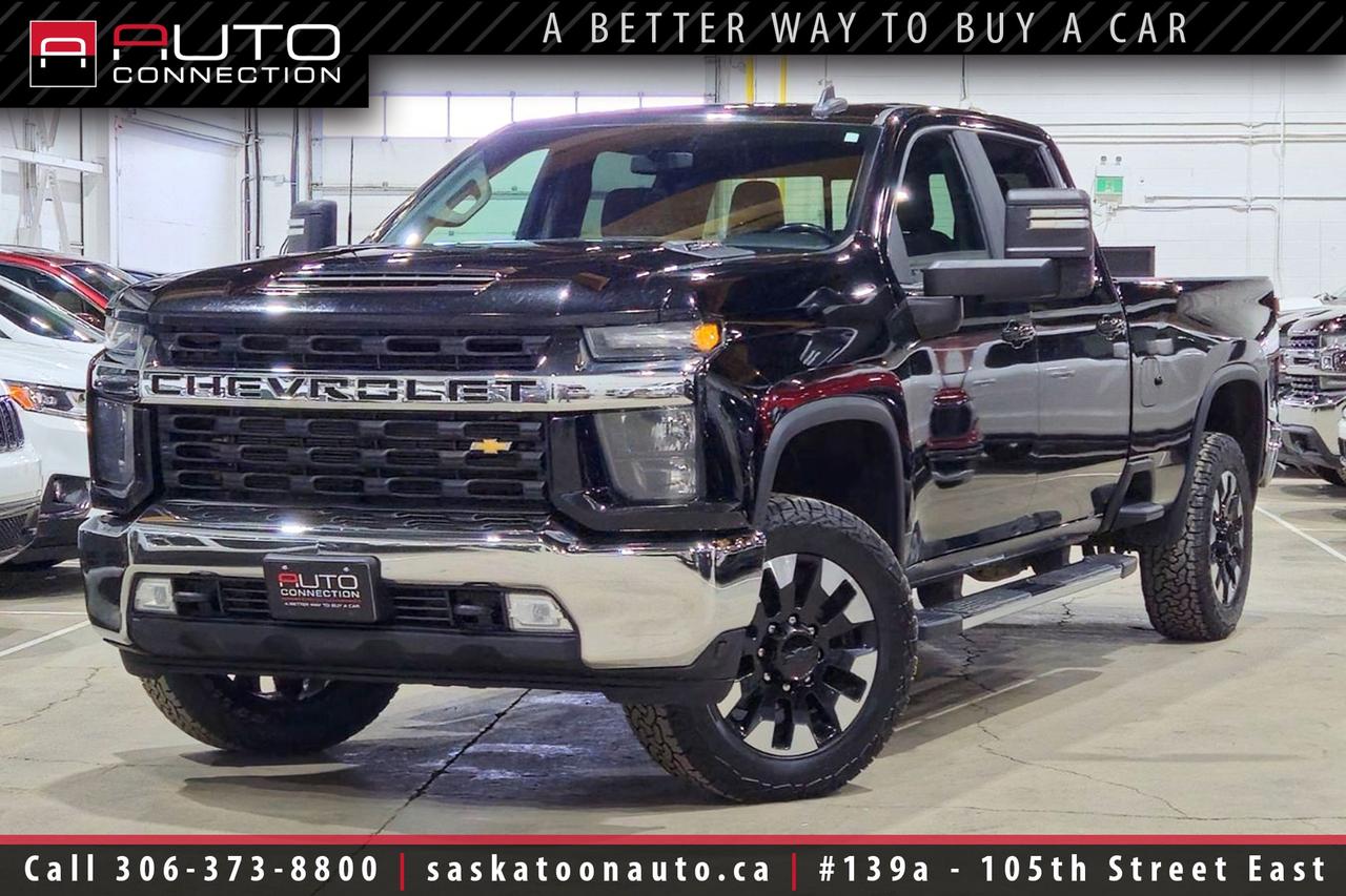 <p><span><font color=#000000><span>Financing & Warranty Available!</span><span><br></span></font></span><span><br></span><span>Crew Cab w/ 8ft. Box - Duramax 6.6L V8 Turbo-Diesel</span><span><br></span><span><br>Conquer heavy-duty jobs with confidence in this <b>2020 Chevrolet Silverado 3500HD LT Crew Cab</b> - powered by the bulletproof 6.6L Duramax V8 turbo-diesel that delivers a massive 445 hp and 910 lb-ft of torque. With true 4x4 capability, Z71 off-road hardware, skid plates and off-road suspension, it is as comfortable climbing rough country as it is towing down the highway. When hauling matters, the Gooseneck/5th Wheel package paired with the Advanced Trailering System, hitch guidance with Hitch View and integrated trailer brake controller make towing up to 21,040 lb. straightforward and safe. Inside, the crew cab pampers long hauls with heated jet-black leather seats, a heated leather-wrapped steering wheel, dual-zone climate control and a power moonroof that opens the cabin to daylight. Technology keeps you connected and in command via the 8-inch HD touchscreen with Apple CarPlay and Android Auto compatibility, HD Rear Vision Camera and a Universal Home Remote. Practical touches like remote start, a rear-sliding power window with defogger, a 120V outlet and a ChevyTec spray-on bedliner show this truck is built to be used, not just admired. A 3.42 rear axle ratio, hill descent control and heavy-duty components mean this Silverado is engineered for real work without sacrificing on-road composure. Finished in sleek black with a jet black leather interior, it presents a professional, low-maintenance look that fits both job sites and weekend plans. Stop by Saskatoon Auto Connection to experience this trail-ready, tow-focused 3500HD in person and let our team show you how it can answer your toughest hauling needs.<br><br></span><span>Key Features:</span><span><br></span><span><br>- 4x4<br>- 6.6L Duramax 8-Cylinder Turbo-Diesel Engine<br>- 445HP & 910lb-ft. of Torque<br>- 10-Speed Automatic Transmission<br>- Z71 Off-Road Package<br>- Convenience Package I & II<br>- Gooseneck/5th Wheel Package<br>- Heated Leather Seats<br>- Heated Leather-Wrapped Steering Wheel<br>- Remote Start<br>- Apple CarPlay & Android Auto Compatibility<br>- Power Moonroof<br>- HD Rear Vision Camera<br>- Hitch Guidance w/ Hitch View<br>- 8-Inch Diagonal HD Colour Touchscreen<br>- Dual-Zone Automatic Climate Control<br>- Rear-Sliding Power Window w/ Defogger<br>- 120V Power Outlet<br>- Universal Home Remote<br>- ChevyTec Spray-On Bedliner<br>- Advanced Trailering System<br>- Trailer Brake Controller<br>- 3.42 Rear Axle Ratio<br>- 21,040lb. Towing Capacity<br>- Off-Road Suspension<br>- Hill Descent Control<br>- Skid Plates<br><br><b>Exterior Colour:</b> Black<br><b>Interior Colour:</b> Jet Black Leather<br><br><b>Manufacturers Brochure:</b> </span><a href=https://www.chevrolet.ca/content/dam/chevrolet/na/canada/english/index/download-a-brochure/02-pdfs/MY20%20CDN%20Commercial%20English.pdf target=_blank><span>https://www.chevrolet.ca/content/dam/chevrolet/na/canada/english/index/download-a-brochure/02-pdfs/MY20%20CDN%20Commercial%20English.pdf</span></a><span><br><br></span><span>Unlock a full year of FREE exclusive VIP benefits with your purchase! Enjoy 20% off labor, 25% off tires, free windshield stone chip repairs, and so much more. Visit saskatoonauto.ca/vip-features for all the details.<br><br></span><span>Honesty Pricing eliminates the haggle hassle by providing you with our lowest possible selling price up front. In fact, it is the lowest price in our market, and we will prove it by disclosing a comprehensive market report of what our competitors are selling similar vehicles for.<br></span><span><br>This vehicle meets our Diamond Certification standard, which begins by selecting only premium quality vehicles and subjecting them to a much more comprehensive inspection process than typical dealerships use. Diamond Certified ensures a clean history, exceptional appearance and problem-free operation.<br></span><span><br>At Saskatoon Auto Connection we sell pre-owned automobiles the way we would like to buy them ourselves. Since 2008, we have been dedicated to providing the highest level of integrity and transparency in our industry, in combination with the highest quality vehicles at the most competitive prices in Saskatchewan. Our friendly staff is ready to positively redefine your expectations of the pre-owned automobile space.</span><span></span></p>