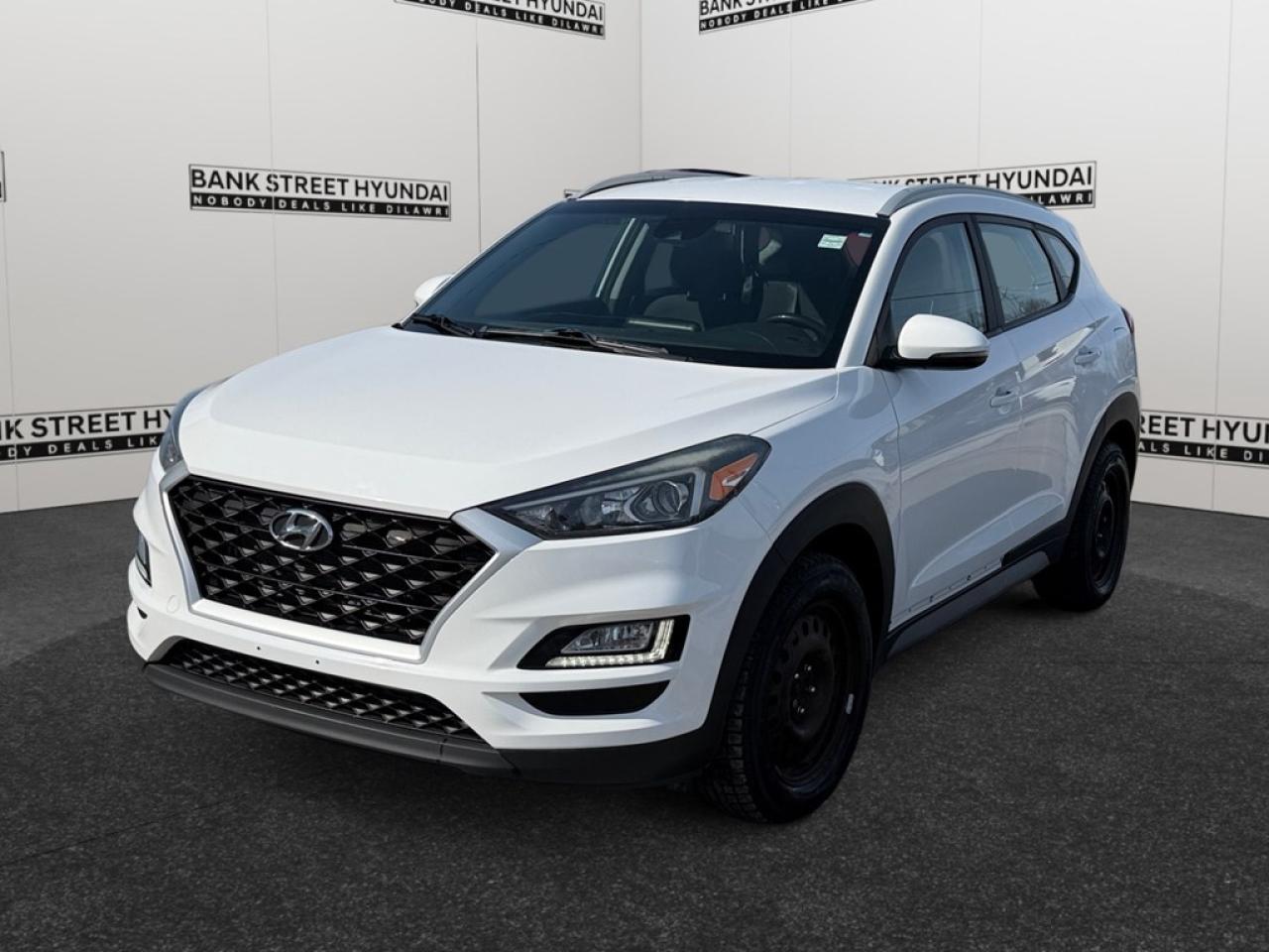 The 2019 Hyundai Tucson Preferred AWD in a stunning white color offers all-wheel drive for confident handling on any road surface. With its bold SUV stance, this Tucson not only provides excellent visibility on the road but also a spacious and inviting cabin for you and your passengers. Inside, the Tucson impresses with heated front and rear seats, a leather steering wheel, and a design that prioritizes both comfort and functionality. The inclusion of a backup camera and smart device integration ensure youre connected and aware, while alloy wheels add a stylish touch to its exterior appearance. Technology is at your fingertips with Bluetooth connectivity and a host of driver assistance features like cruise control, lane assist, and keyless entry. Safety is also a priority with brake assist ensuring peace of mind during your travels. This Hyundai Tucson is an ideal choice for families seeking reliability and those who love to explore with its SUV capabilities. To learn more about how this vehicle can fit into your lifestyle, contact us at the dealership today.
