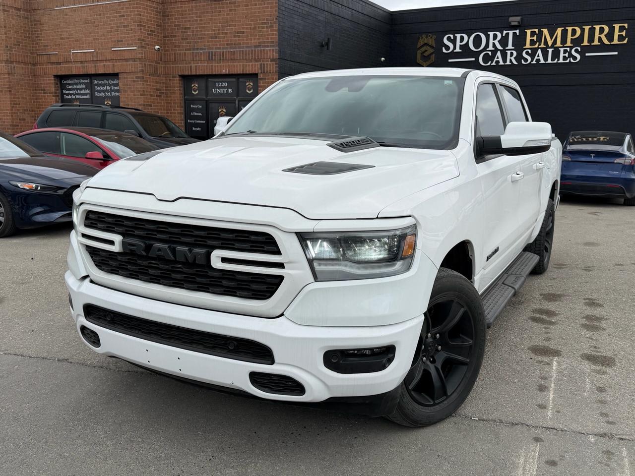 <p>*FULLY LOADED* *SPORT* *HEATED SEATS* *SUNROOF* *AUTOMATIC* *BLIND SPOT MONITORING* *REVERSE CAMERA* Safety Certificate NOT included in the price |SAFETY: $699Year :2022Make: Ram     Model: 1500Trim: Sport 4X4 Crew Cab 57 BoxKms: 110,832Price: $33,880&nbsp;<span id=jodit-selection_marker_1775841409874_4897109869835369 data-jodit-selection_marker=start style=line-height: 0; display: none;></span> cash price: $34,880&nbsp; &nbsp;Sport empire cars Offering a beautiful Ram 1500  with ONLY 110,832 kms!! For the affordable price of $33,880+HST and licensing. Beautiful White exterior with a Black leather interior. Professionally detailed and ready to go. Perfect combination of reliability, comfort and luxury. Buy with Trust with an Ontario registered dealer. Please note: The listed price is a finance-only special. If you wish to purchase the vehicle with cash, a $1,000 premium will be added to the sale price.** In accordance with OMVIC regulations, please be advised that the vehicle being offered is not currently certified, e-tested or drivable.Certification is available for an additional fee starting from $699. With our safety package the vehicle comes with a 36 day safety standard warranty, complimentary oil change and inspection reportVIN: 1C6SRFVT6NN105812 </p>