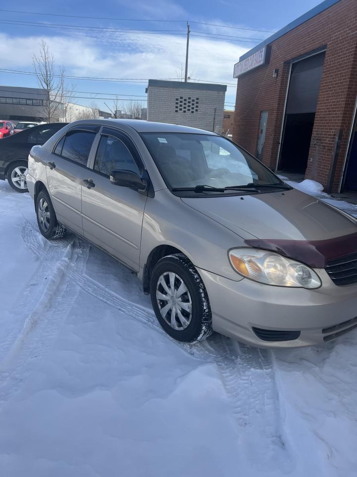 2004 Toyota Corolla 4dr Sdn CE Auto ac power windows,locks Photo1