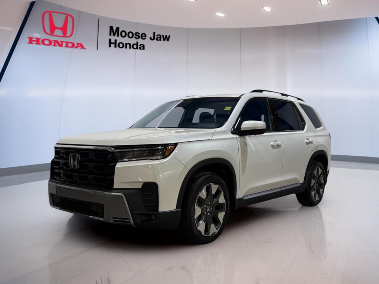 Meet the brand new 2026 Honda Pilot Touring, now at Moose Jaw Honda in Moose Jaw. Finished in clean White with a Black interior, this SUV is built for busy family life and long highway days. It blends confident power, secure all-wheel traction, and a smooth 10-speed automatic transmission.

Under the hood, the 2026 Honda Pilot Touring uses a 3.5 L V6 24V DOHC engine with Dual VTC. Power delivery feels natural and strong, and the 10-speed automatic -inc: Shift helps keep acceleration smooth while staying calm at cruising speeds. With traction intégrale translated to all-wheel drive, you get added grip when roads turn slick.

This brand new 2026 Honda Pilot Touring is a smart fit for Saskatchewan driving. Its ready for winter commutes, summer road trips, and all the in-between errands that fill your week. If you want a three-row SUV that feels composed and capable, this one deserves a close look.

FEATURES OF THE Pilot Touring  
»» 3.5 L V6 with Dual VTC  
»» 10-speed automatic transmission with Shift  
»» All-wheel drive for year-round traction  
»» White exterior with Black interior  

ADVANCED SAFETY FEATURES  
»» All-wheel drive helps maintain road grip  
»» Stable handling feel in changing conditions  
»» Confident braking response with V6 power  
»» Predictable shifting supports controlled acceleration  

PERFORMANCE AND EFFICIENCY  
»» 3.5 L V6 delivers smooth power  
»» Dual VTC helps optimize engine response  
»» 10-speed automatic for refined cruising  
»» All-wheel drive supports confident takeoff  

COMFORT AND CONVENIENCE  
»» Three-row SUV layout suits busy families  
»» Automatic transmission simplifies stop-and-go driving  
»» Easy daily driving with stable road manners  
»» Cabin colour scheme: Black interior  

TECHNONOLGY AND CONNECTIVITY  
»» Clear driver information through modern instrument layout  
»» Shift logic supports smooth, easy operation  
»» Controls designed for quick driver access  
»» Touring-focused setup for daily usability  

CARGO SPACE  
»» SUV cargo area for everyday hauling  
»» Room for groceries, gear, and bags  
»» Practical space for trips and errands  
»» Flexible layout for changing passenger needs  

WHAT OTHER OWNERS LIKE  
»» Smooth V6 power for highway merging  
»» Confident feel from all-wheel drive  
»» Refined shifting from 10-speed automatic  
»» Practical three-row versatility for families  

This 2026 Honda Pilot Tourings VIN is: 5FNYG1H71TB500602.<p> the 2026 Honda Pilot Touring uses a 3.5 L V6 24V DOHC engine with Dual VTC. Power delivery feels natural and strong</p>
<p> and the 10-speed automatic -inc: Shift helps keep acceleration smooth while staying calm at cruising speeds. With traction intégrale translated to all-wheel drive</p>
<p> you get added grip when roads turn slick.

This brand new 2026 Honda Pilot Touring is a smart fit for Saskatchewan driving. Its ready for winter commutes</p>
<p> and all the in-between errands that fill your week. If you want a three-row SUV that feels composed and capable</p>
<p> this one deserves a close look.

FEATURES OF THE Pilot Touring  
»» 3.5 L V6 with Dual VTC  
»» 10-speed automatic transmission with Shift  
»» All-wheel drive for year-round traction  
»» White exterior with Black interior  

ADVANCED SAFETY FEATURES  
»» All-wheel drive helps maintain road grip  
»» Stable handling feel in changing conditions  
»» Confident braking response with V6 power  
»» Predictable shifting supports controlled acceleration  

PERFORMANCE AND EFFICIENCY  
»» 3.5 L V6 delivers smooth power  
»» Dual VTC helps optimize engine response  
»» 10-speed automatic for refined cruising  
»» All-wheel drive supports confident takeoff  

COMFORT AND CONVENIENCE  
»» Three-row SUV layout suits busy families  
»» Automatic transmission simplifies stop-and-go driving  
»» Easy daily driving with stable road manners  
»» Cabin colour scheme: Black interior  

TECHNONOLGY AND CONNECTIVITY  
»» Clear driver information through modern instrument layout  
»» Shift logic supports smooth</p>
<p> easy operation  
»» Controls designed for quick driver access  
»» Touring-focused setup for daily usability  

CARGO SPACE  
»» SUV cargo area for everyday hauling  
»» Room for groceries</p>
<p> and bags  
»» Practical space for trips and errands  
»» Flexible layout for changing passenger needs  

WHAT OTHER OWNERS LIKE  
»» Smooth V6 power for highway merging  
»» Confident feel from all-wheel drive  
»» Refined shifting from 10-speed automatic  
»» Practical three-row versatility for families  

This 2026 Honda Pilot Tourings VIN is: 5FNYG1H71TB500602.</p>