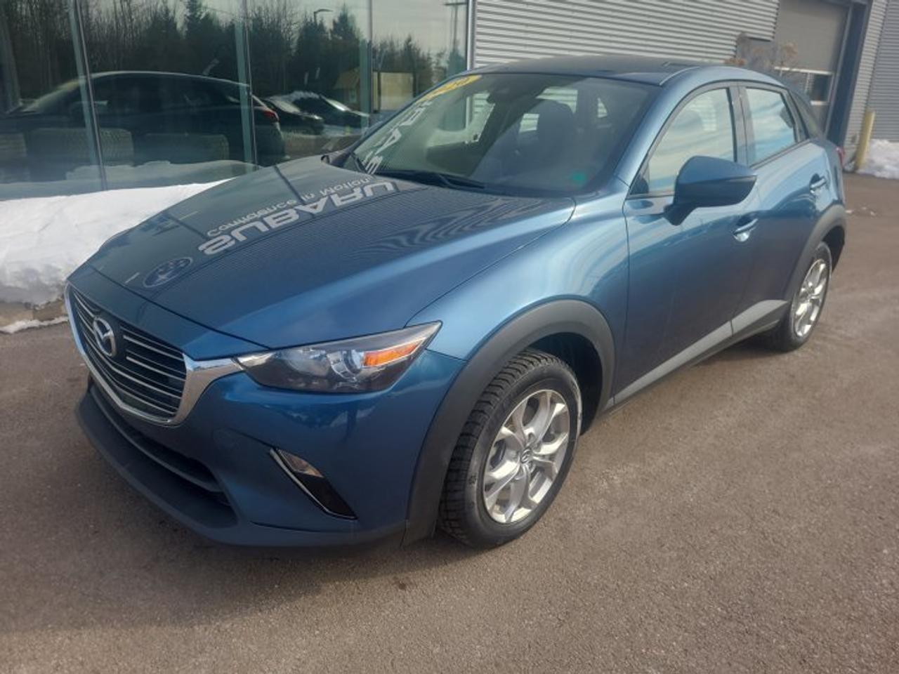 This 2020 Mazda CX-3 GS delivers the perfect balance of dynamic performance, upscale design, and everyday practicality. With its sleek exterior styling and driver-focused interior, the CX-3 stands out in the subcompact SUV segment.Performance & EfficiencyPowered by a responsive 2.0L SKYACTIV-G 4-cylinder engine, the CX-3 produces 148 horsepower paired with a smooth 6-speed automatic transmission. Mazdas renowned chassis tuning provides agile handling and confident cornering, making it equally enjoyable in city traffic or on the highway. Excellent fuel economy ensures fewer stops at the pump.Exterior Features16-inch alloy wheelsLED daytime running lightsBody-coloured heated side mirrorsRear spoilerCompact SUV stance with bold front grille stylingInterior & ComfortThe GS trim adds upgraded comfort and convenience features:Heated front seatsHeated steering wheelPremium cloth upholsteryLeather-wrapped steering wheel and shift knob60/40 split-folding rear seats for flexible cargo spaceTechnology & Connectivity7-inch touchscreen display with Mazda ConnectApple CarPlay & Android AutoBluetooth hands-free calling and audio streamingRearview cameraSteering wheel-mounted audio and cruise controlsSafetyEquipped with advanced safety features including:Blind Spot MonitoringRear Cross Traffic AlertStability and traction control systemsAdvanced front and side-impact airbagsThis 2020 Mazda CX-3 GS is ideal for drivers seeking sporty handling, modern technology, and compact SUV versatility in a reliable and stylish package.Contact us today to book your test drive this CX-3 wont last long!