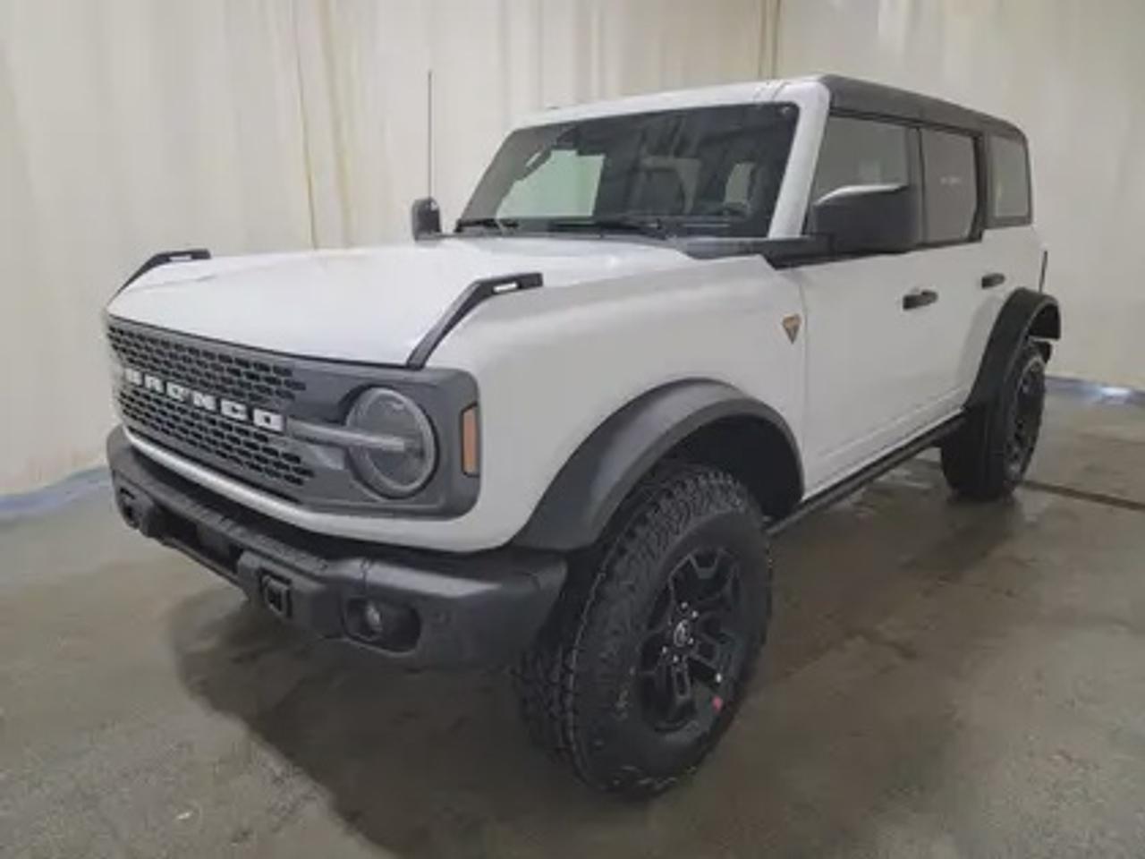 The 2026 Ford Bronco Badlands 334A is built for those who demand the ultimate in off-road performance and everyday capability. Finished in Oxford White, this rugged yet refined SUV comes with a 2.7L EcoBoost® V6 engine, delivering 315 horsepower and 410 lb-ft of torque. When paired with the 10-speed automatic transmission, this powerhouse is engineered to conquer the toughest terrains while offering an impressive 13.8L/100km (20 Miles Per Gallon) combined fuel economy.

Key Features:
360 Degree Camera
Adaptive Cruise Control
B&O® Sound System by Bang & Olufsen® 12 Speakers including Subwoofer
Front Row Heated Seats 
Evasive Steering Assist 
Front Parking Sensors 
Heated Steering Wheel 
Apple CarPlay® & Android Auto 
Push Button Start 
Remote Start System 
Rear Parking Sensors 
Ford Co-Pilot360 Technology
BLIS® (Blind Spot Information System) with Cross-Traffic Alert
Pre-Collision Assist with Automatic Emergency Braking
Lane-Keeping System with Driver Alert
Terrain Management System with G.O.A.T. Modes (Goes Over Any Terrain)
17 Machined Carbonized Grey-Painted Aluminum Wheels for a rugged look
Hard Top Moulded in colour
Engine Block Heater
Sound Deadening Headliner

This vehicle comes with the All-Weather Packageready to take on any season!
Snow, rain, mud, or sunshinethis vehicle is built for it all! The All-Weather Package adds extra protection where it matters most, with premium mud flaps to shield your paint from road debris, all-weather floor mats to protect your interior from lifes messes, and Xpel paint protection to help guard against those infuriating rock chips. Drive with confidence, knowing your investment is protected from Reginas elements.

Bennett Dunlop Ford, proudly serving Regina for over 40 years, is conveniently located at 770 Broad Street. With over 3,500 Google reviews, our reputation reflects our commitment to providing a fast, easy, and enjoyable vehicle-buying experience. We eliminate the hassle with no admin or documentation fees, transparent upfront pricing lets you shop with total confidence. But were more than just a dealershipwere driven to make a difference by supporting local community initiatives and events that matter to you. Visit Bennett Dunlop Ford today and experience why were Reginas trusted choice for quality vehicles, exceptional service, and a genuine commitment to driving change in our community!