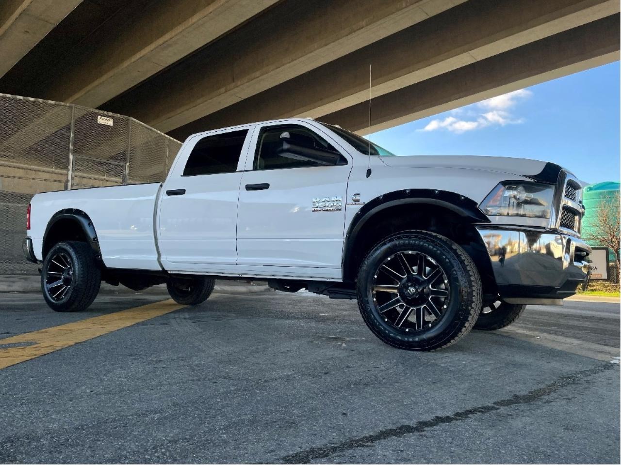 COMPLETE 2020 BIGHORN MODEL UPDATED INCLUDES NEW LONG BOX, TAIL LIGHTS, TAILGATE, & REAR BUMPER, SXT CREW LONG BOX 6.7L CUMMINS DIESEL, FUEL WHEELS, FENDER FLARES, TUNED, SUPER CLEAN TRUCK

RAM 3500 SXT CREW CAB 4X4 
Exterior Color: Bright White Interior Color: Black interior / Diesel Grey seats Interior: Cloth front 40/20/40 split bench seat Engine: 6.7L Cummins I6 turbocharged diesel engine Transmission: 6speed automatic transmission 
STANDARD EQUIPMENT (UNLESS REPLACED BY OPTIONAL EQUIPMENT)
FUNCTIONAL / SAFETY FEATURES
Advanced multistage front air bags
Supplemental side air bags
Supplemental front seat side air bags
Supplemental side curtain air bags
Manual shiftonthefly transfer case
4wheel antilock disc brakes
Antispin differential rear axle
Electronic Stability Control
Heavyduty engine cooling
Front heavyduty shock absorbers
Rear heavyduty shock absorbers
Sentry Key antitheft engine immobilizer
Locking tailgate
3.5inch Electronic Vehicle Information Centre
Automatic headlamps
Quadlens halogen headlamps
4pin wiring harness
7pin wiring harness
Class V hitch receiver
Engine block heater
730amp maintenancefree battery
12volt auxiliary power outlet  centre console
3.73 rear axle ratio
INTERIOR FEATURES
Heavyduty vinyl front 40/20/40 split bench seat
Rear folding seat
Secondrow infloor storage bins
Remote USB port  charge only
Rear underseat compartment storage
Black vinyl floor covering
Air conditioning
Cruise control
Tilt steering column
Manual adjust seats
Front height adjusting shoulder belts
Power windows with front onetouch up and down
Power locks
Rear fixed window
Instrument cluster with display screen
Radio 3.0
6 speakers
Media hub with USB port and auxiliary input jack
Remote USB port
Audio jack input for mobile devices
EXTERIOR FEATURES
18x8inch styled steel wheels
LT275/70R18E BSW AllSeason tires
Fullsize spare tire
OPTIONAL EQUIPMENT (May Replace Standard Equipment)
Customer Preferred Package 2FA 
Protection Group $125
Transfer case skid plate 
SXT Appearance Group $1,000
Popular Equipment Group 
Cloth front 40/20/40 split bench seat 
SiriusXM satellite radio with 1year subscription 
Remote keyless entry 
Black, power, manual folding, trailer tow mirrors 
Bright rear bumper 
Exterior mirrors with supplemental turn signals 
Exterior mirrors with courtesy lamps 
Heated exterior mirrors 
Front and rear floor mats 
Carpet floor covering 
Bright front bumper 
220amp alternator $50
Delete carpet 
Delete floor mats 
6speed automatic transmission $2,155
3.42 rear axle ratio 
Electronic shiftonthefly transfer case $200
6.7L Cummins I6 turbocharged diesel engine $9,445
180amp alternator 
Selective Catalytic Reduction (UREA) 
Diesel exhaust brake 
Ram Active Air 
Winter front grille cover 
Auxiliary switches in instrument panel $200
Clearance lamps $100
LT275/70R18E OWL On/OffRoad tires $350
Uconnect 3.0 $375
Handsfree communication with Bluetooth streaming 
ParkSense Rear Park Assist System $425
Trailer Brake Control $350
Upfitter electronic module (VSIM) $200
Federal A/C Excise Tax $100
Destination Charge $1,795

Price does not include $599 documentation fee and/or $699 finance fee.