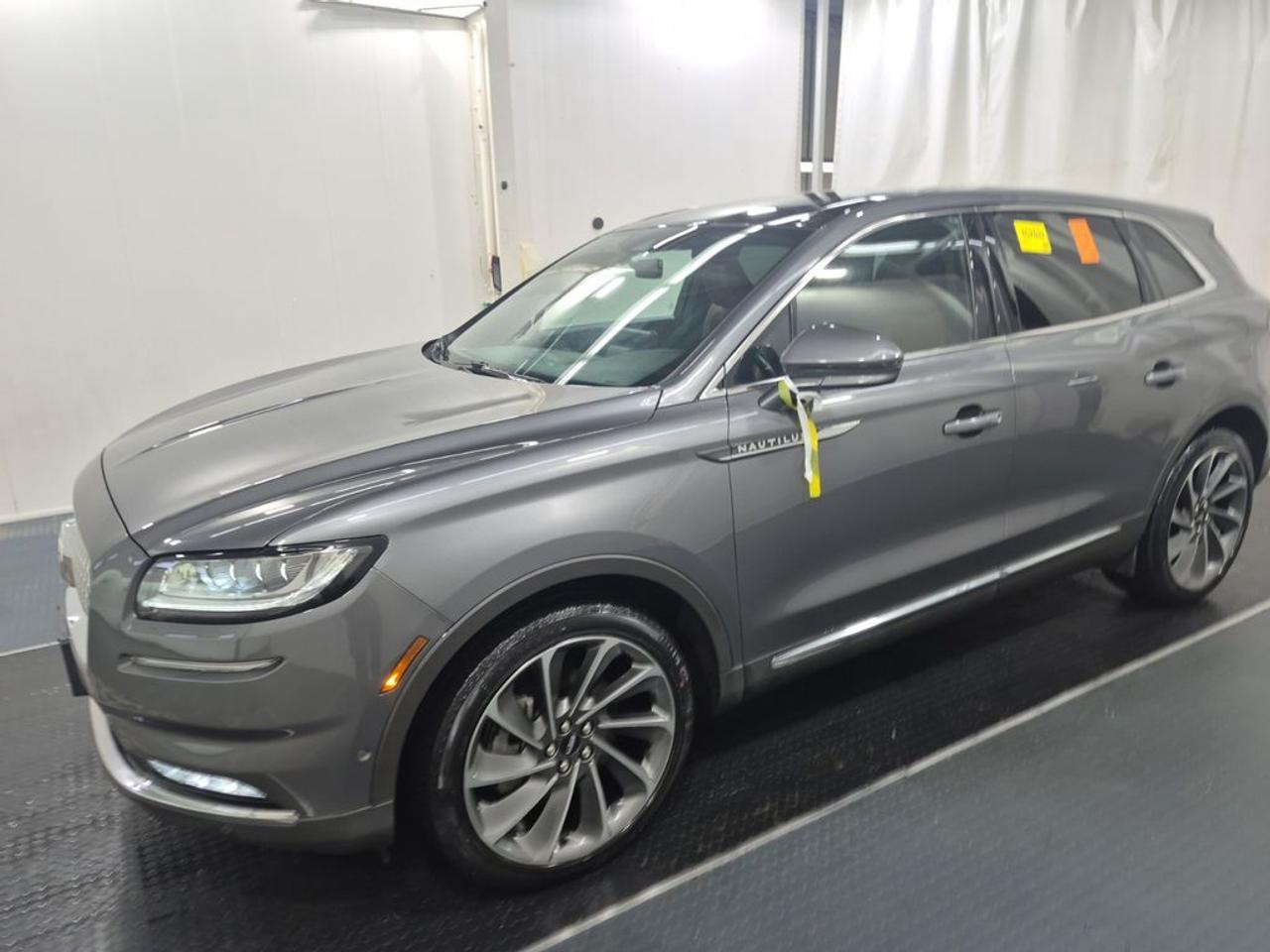 THE PRICE YOU SEE, PLUS GST. GUARANTEED!APPLE CARPLAY/ANDROID AUTO COMPATABLE! 2.7 LITER GTDI V6, 8 SPEED AUTO, RESERVE AWD(201a), EBONY/ROAST PERFORATED LEATHER SEATS, ULTIMAT PKG, CARGO UTILITY PKG, LED MATRIX HEADLAMPS, CLASS II TRAILER TOW PKG, MINI SPACE SAVER SPARE, REVELL II AUDIO, BLIND SPOT DETECTION, SYNC 4 INFOTAINMENT.      The 2022 Lincoln Nautilus Reserve AWD with the 2.7-liter EcoBoost twin-turbo V6 engine offers a refined blend of power, luxury, and versatility. The 2.7L engine delivers a smooth yet energetic driving experience, providing ample acceleration and confident handling while maintaining a relatively efficient fuel economy for its class. The Ultimate Package elevates the Nautiluss luxury features, including premium leather upholstery, advanced interior lighting, upgraded sound systems, and sophisticated driver-assistance technologies such as a 360-degree camera, adaptive cruise control, and active park assist. The 201A Package enhances connectivity and convenience with features like a large touchscreen infotainment system, premium audio, and wireless charging, making every drive more enjoyable and connected. The Cargo Utility Package adds practical storage solutions, including a hands-free power liftgate, cargo net, and organizational compartments, which improve cargo management and accessibility. Overall, this configuration emphasizes a luxurious, tech-forward driving experience combined with versatile utility, making the Nautilus a refined choice for those seeking comfort, convenience, and capability in a midsize luxury SUV.Do you want to know more about this vehicle, CALL, CLICK OR COME ON IN!*AMVIC Licensed Dealer; CarFax and Full Mechanical Inspection Included.