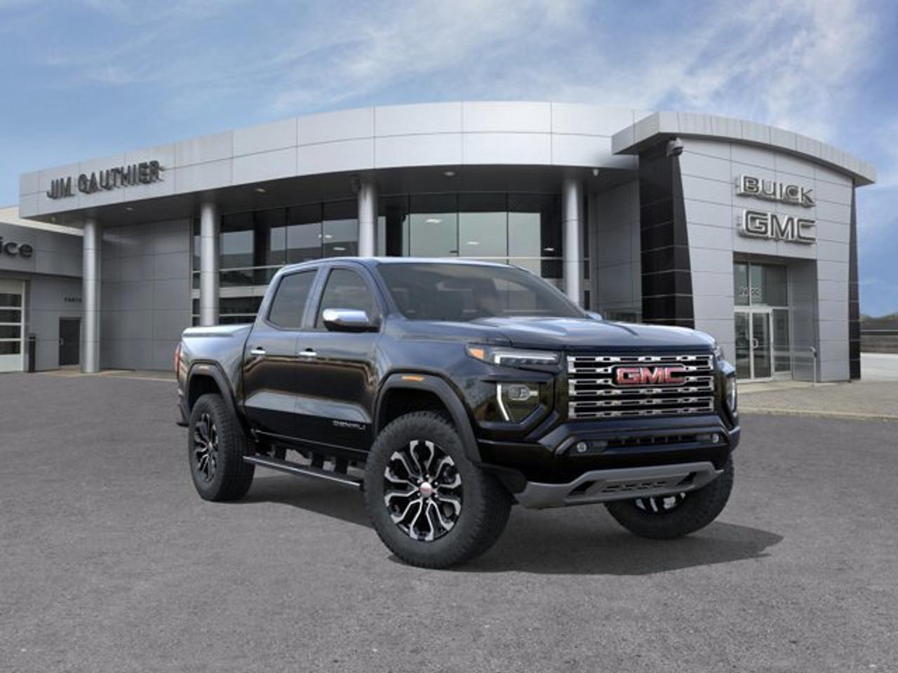 The 2026 GMC Canyon Denali blends upscale comfort with rugged capability, featuring a high-torque 310-hp TurboMax engine alongside a 2-inch factory lift and ultra-wide stance for confident off-road and trailering performance---boasting a towing capacity of up to 7,700 lbs. Its refined interior showcases Denali-exclusive Jet-Black leather-appointed seats with teak wood accents, a first-in-class 6.3-inch multicolor head-up display, a sunroof and a Bose premium audio system complemented by an 11.3-inch center touchscreen and HD Surround Vision with up to 10-camera views---including unique underbody perspectives. Outside, the truck distinguishes itself with a sculpted chrome grille, exclusive 20-inch diamond-cut aluminum wheels, chrome assist steps, sunroof and a MultiStow tailgate offering integrated storage with a drain---perfectly balancing style and utility.