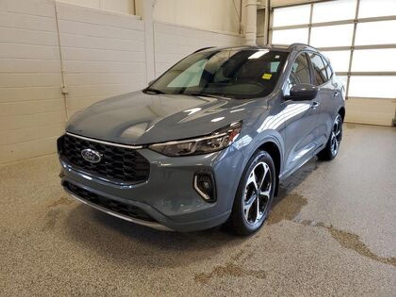 **HOT TRADE ALERT!!** Take a look at this locally owned, one-owner 2023 Ford Escape ST-Line Elite AWD  serviced right here! This sporty and efficient SUV is powered by a 2.5L i-VCT Atkinson-cycle 4-cylinder hybrid engine paired with an eCVT transmission for smooth, responsive performance and impressive fuel economy. With bold ST-Line styling, premium Elite features, and confident all-wheel drive capability, this Escape delivers the perfect balance of performance, efficiency, and modern technology. Dont miss out on this sharp, hard-to-find hybrid SUV!

Key Features:
Automatic High Beams
Cloth Seats
Heated Seats
Power Driver Seat
Memory Seats
Bluetooth
SYNC
Cruise Control
Blind Spot Warning
Pre-Collision Assist
Keyless Entry
Push Button Start
Remote Start

After this vehicle came in on trade, we had our fully certified Pre-Owned Ford mechanic perform a mechanical inspection. This vehicle passed the certification with flying colors. After the mechanical inspection and work was finished, we did a complete detail including sterilization and carpet shampoo. 

Moose Jaw Ford, conveniently located at 1010 North Service Road in Moose Jaw, is your trusted destination for all your automotive needs. With an impressive 4.8-star Google rating from nearly 1,500 reviews, we are proud to deliver an exceptional vehicle-buying experience tailored just for you. Our Moose Jaw Motives set us apart, offering unbeatable value like half-priced oil changes for life on pre-owned vehicles, one year of key and remote protection, and one year of tire and rim protection. Enjoy peace of mind with every purchase. At Moose Jaw Ford, were committed to driving positive change in our community by combining exceptional service, high-quality vehicles, and a guest-first approach. Visit us today!