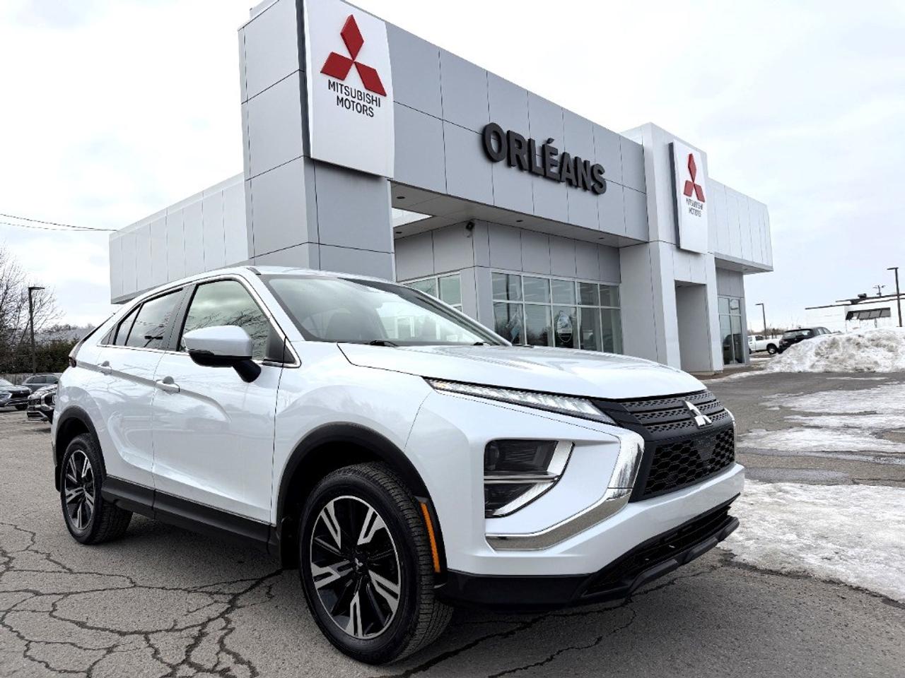 The 2024 Mitsubishi Eclipse Cross ES S-AWC is a stunning SUV that stands out in its elegant white color. Paired with a robust 4×4 drivetrain, this vehicle promises excellent handling and performance on any terrain. When it comes to style and comfort, the Eclipse Cross delivers with its sleek design and cozy interior. It features alloy wheels, heated mirrors, and heated front seats, adding extra comfort to every drive. The spacious interior is thoughtfully designed with features like keyless entry, power windows, cruise control, and more to ensure a seamless driving experience. In terms of technology, this SUV is equipped with advanced options including a backup camera, smart device integration, and Bluetooth connectivity, keeping you connected and safe on the road. Adding to that, satellite radio and heated seats ensure every journey is enjoyable. The presence of a brake assist system further enhances safety, providing peace of mind wherever you go. Perfect for families and adventurers alike, the Mitsubishi Eclipse Cross ES S-AWC is the ideal choice for those seeking reliability, technology, and style in one package. Contact us today to learn more and take this extraordinary SUV for a test drive!
