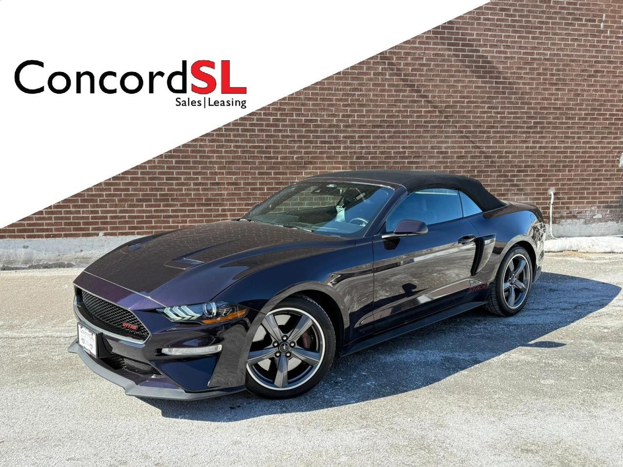 <p class=MsoNormal>This <strong>2022 Ford Mustang GT Convertible Premium California Special Performance Pack</strong> is an iconic 4-passenger sports car that delivers open-air performance powered by the legendary <strong>5.0L Ti-VCT V8 producing 450 horsepower</strong>, paired with a responsive <strong>10-speed automatic transmission with paddle shifters</strong>. Finished in head-turning <strong>Mischievous Purple Metallic</strong> over <strong>Ebony leather with red stitching</strong>, this GT blends classic muscle heritage with modern technology and track-inspired capability.</p><div class=MsoNormal style=text-align: center; align=center><hr align=center size=2 width=100%></div><p class=MsoNormal><strong>Optional Equipment:</strong></p><p class=MsoNormal>&middot; <strong>Equipment Group 401A (Premium Trim with Color Accent Group)</strong> &ndash; Enhanced interior finishes and upscale appointments</p><p class=MsoNormal>&middot; <strong>Ford Safe & Smart Package</strong> &ndash; Adaptive Cruise Control & Voice-Activated Touchscreen Navigation System</p><p class=MsoNormal>&middot; <strong>10-Speed Automatic Transmission with Paddle Shifters</strong></p><p class=MsoNormal>&middot; <strong>California Special Package</strong> &ndash; Unique side scoops, special badging, side stripe, exclusive 19 Carbonized Gray painted aluminum wheels, and distinctive interior accents</p><p class=MsoNormal>&middot; <strong>GT Performance Package</strong>:</p><ul style=margin-top: 0cm; type=disc><li class=MsoNormal style=mso-list: l0 level1 lfo1; tab-stops: list 36.0pt;>3.55 TORSEN&reg; Limited-Slip Rear Axle</li><li class=MsoNormal style=mso-list: l0 level1 lfo1; tab-stops: list 36.0pt;>Larger Brembo performance brakes</li><li class=MsoNormal style=mso-list: l0 level1 lfo1; tab-stops: list 36.0pt;>Summer performance tires (255F/275R 19)</li><li class=MsoNormal style=mso-list: l0 level1 lfo1; tab-stops: list 36.0pt;>Performance chassis tuning</li></ul><p class=MsoNormal>&middot; <strong>MagneRide&reg; Adaptive Damping System</strong> &ndash; Real-time suspension adjustment for optimal comfort and handling</p><p class=MsoNormal>&middot; <strong>Active Valve Performance Exhaust</strong> &ndash; Adjustable exhaust note from refined to aggressive</p><p class=MsoNormal>&middot; <strong>B&O Premium Sound System (12 Speakers)</strong></p><p class=MsoNormal>&middot; <strong>Black Stripe with Red Accent</strong></p><div class=MsoNormal style=text-align: center; align=center><hr align=center size=2 width=100%></div><p class=MsoNormal><strong>Standard Premium Features Include:</strong></p><p class=MsoNormal><strong>Exterior Highlights:</strong></p><p class=MsoNormal>&middot; LED Headlamps & LED Tail Lamps<br>&middot; Dual Bright Exhaust Tips<br>&middot; Daytime Running Lights & Fog Lamps<br>&middot; Power Heated Side Mirrors</p><p class=MsoNormal><strong>Interior Comfort & Technology:</strong></p><p class=MsoNormal>&middot; Heated & Cooled Front Leather Seats<br>&middot; Power Driver Seat with Lumbar & Power Passenger Seat<br>&middot; Dual-Zone Electronic Climate Control<br>&middot; Leather-Wrapped Steering Wheel with Controls<br>&middot; SYNC&reg; 3 Infotainment System<br>&middot; SiriusXM Satellite Radio (3-Month Trial)<br>&middot; Intelligent Access with Push-Button Start<br>&middot; Reverse Camera & Reverse Sensing System</p><div class=MsoNormal style=text-align: center; align=center><hr align=center size=2 width=100%></div><p class=MsoNormal><strong>Safety & Security:</strong></p><p class=MsoNormal>&middot; AdvanceTrac&reg; Stability Control<br>&middot; 4-Wheel Disc Anti-Lock Brakes<br>&middot; Full Airbag System Including Front & Side Airbags<br>&middot; SOS Post-Crash Alert System<br>&middot; SecuriLock&reg; Anti-Theft System<br>&middot; Tire Pressure Monitoring System</p><div class=MsoNormal style=text-align: center; align=center><hr align=center size=2 width=100%></div><p class=MsoNormal>With its naturally aspirated V8 power, precision handling upgrades, and striking California Special styling, this Mustang GT Convertible offers an exhilarating blend of <strong>muscle car performance and premium comfort</strong> &mdash; perfect for spirited driving with the top down.</p><p class=MsoNormal>Vehicle is being sold with a <strong>valid Ontario safety inspection certificate</strong> and fresh Oil Change.</p><p class=MsoNormal><strong>Sale Price plus H.S.T. and Licensing. Financing and Leasing options available.</strong></p><p class=MsoNormal>Call <strong>Concord Sales and Leasing</strong>, your <strong>Truck and Specialty Vehicle Experts</strong>, today to book your appointment.</p>