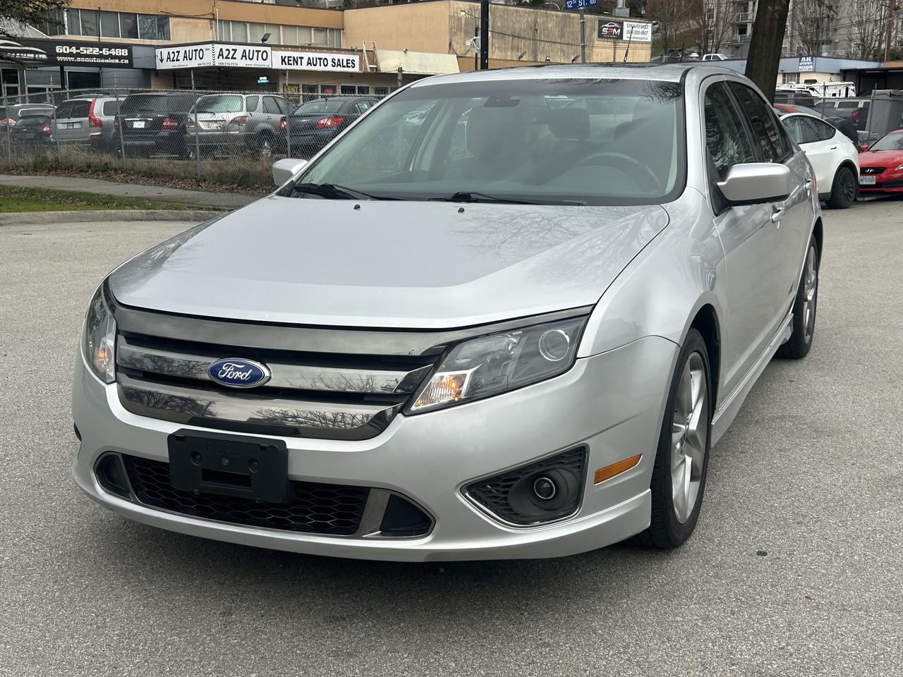 <p>Please check out our website<a href=https://milani.biz/> </a><strong><a href=https://milani.biz/>https://milani.biz/</a> for Carfax information.&nbsp;</strong></p><p> Come check out what&rsquo;s new at<strong> Milani Auto Sales!</strong><br>Proudly serving Burnaby for over 30 years.</p><p><strong>We buy, sell, and trade</strong> clean cars and trucks &mdash; with <strong>financing and leasing options (OAC) and easy bi-weekly payments!</strong></p><p> Independent vehicle inspection complete<br> Vehicle history report included</p><p>Looking for a stylish and capable sedan thats ready for anything Canadian roads can throw at it? Check out this sharp 2012 Ford Fusion SPORT AWD, now available at Milani Auto Sales! This sleek silver sedan is more than just a pretty face &ndash; its engineered for performance and delivers a driving experience youll love. With its robust 6-cylinder engine and all-wheel-drive system, youll feel confident and in control, whether youre navigating city streets or cruising on the highway. This well-maintained Fusion has 175,863km on the odometer, ready to provide many more years of reliable service.</p><p>This 2012 Fusion SPORT AWD from Milani Auto Sales is packed with features designed to enhance your driving experience. Heres a quick look at what makes this car stand out:</p><ul><li><strong>Sporty Performance:</strong> The powerful 6-cylinder engine provides thrilling acceleration and a responsive driving experience, making every journey enjoyable.</li><li><strong>All-Wheel Drive Confidence:</strong> Conquer any weather condition with the assurance of all-wheel drive, providing superior traction and stability.</li><li><strong>Sleek and Stylish Design:</strong> Turn heads with the Fusions modern design.</li><li><strong>Automatic Transmission:</strong> Smooth and effortless gear changes provide a comfortable driving experience.</li><li><strong>Spacious Interior:</strong> Enjoy a comfortable cabin for both the driver and passengers.</li></ul><p><strong><em>Powered by AutoIntelligence&trade;</em></strong> Vehicle information has been generated using artificial intelligence and is provided for informational purposes only. While efforts are made to ensure accuracy, please confirm all details directly with the dealer.</p>