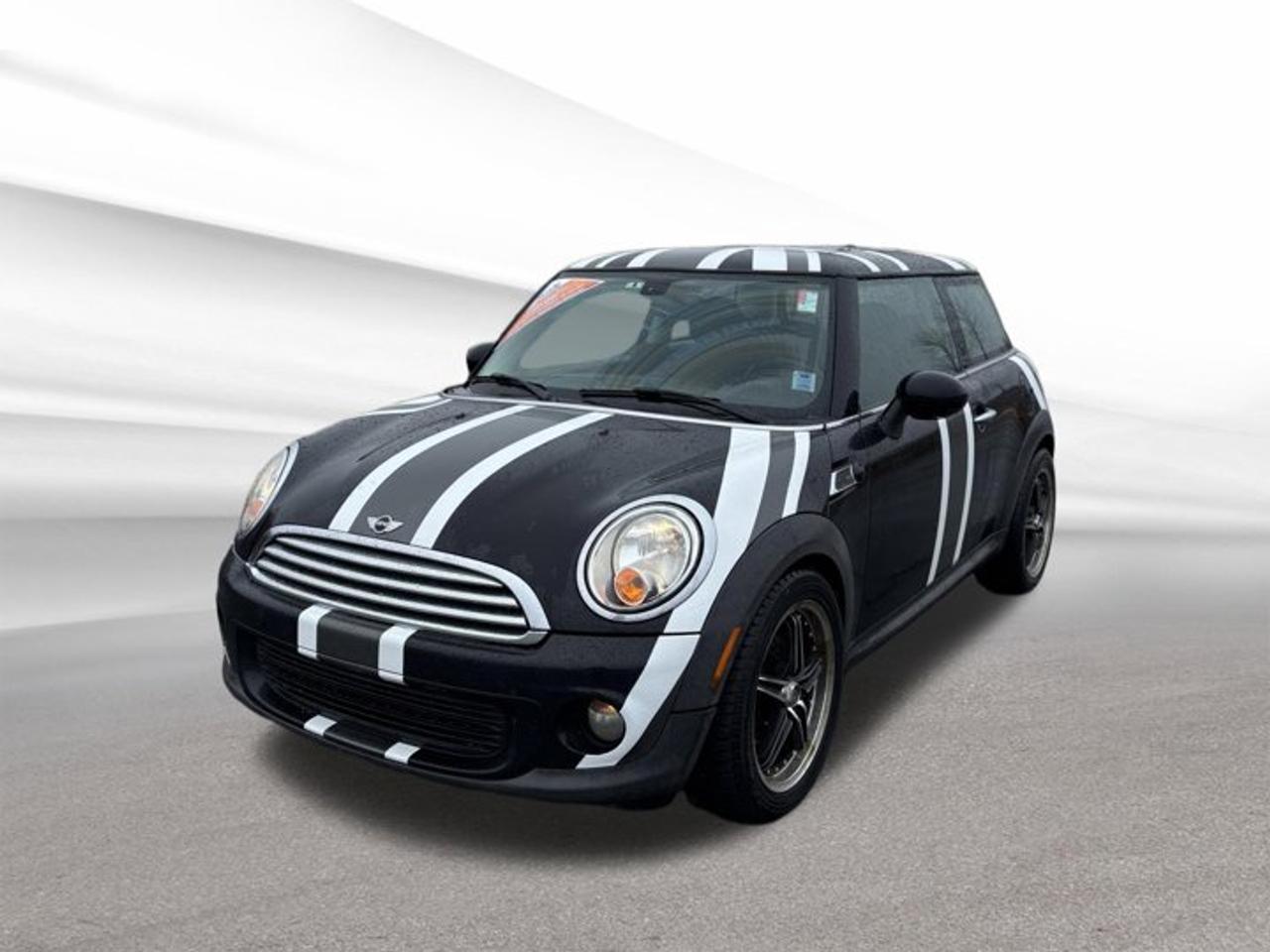 Meet the Hatchback 2013 Mini Cooper Hardtop Base Used, offered by Steele Halifax Chrysler Dodge Jeep Ram FIAT and ready for Halifax streets. With its black exterior and classic 2-door shape, this Mini keeps things simple, fun, and easy to place in tight city parking. The manual transmission adds real driver control, while the front-wheel drive layout helps keep handling predictable in all seasons.This Hatchback 2013 Mini Cooper Hardtop Base Used has 234,615 km on the odometer, making it a well-travelled car with plenty of road experience. Its powered by a gas 1.6 L inline 4-cylinder engine, a proven setup known for compact packaging and everyday usability. If you want a small hatch that feels connected to the road, this Mini delivers that direct, engaging feel many drivers still prefer.ADVANCED SAFETY FEATURESFront-wheel drive for stable tractionCompact size helps avoid tight scrapesManual control supports attentive drivingTwo-door design improves side visibilityPERFORMANCE AND EFFICIENCY1.6 L gas inline-four engineManual transmission for direct driver controlFront-wheel drive for confident handlingCompact hatchback built for city efficiencyCOMFORT AND CONVENIENCETwo-door layout for easy front accessHatchback design for quick loadingCompact footprint suits urban parkingSimple cabin layout, easy to useTECHNONOLGY AND CONNECTIVITYDriver-focused controls within easy reachClear gauges for quick readoutsStraightforward layout reduces distractionsPractical design supports daily commutingCARGO SPACERear hatch opening for easy accessRoom for groceries and small gearCompact load area suits city needsHatchback shape improves everyday versatilityWHAT OTHER OWNERS LIKEFun manual shifting and nimble feelEasy parking in busy areasDistinct Mini styling and characterPractical hatchback usefulness for errandsIf youre shopping for a compact, manual hatchback with personality, this Hatchback 2013 Mini Cooper Hardtop Base Used is a smart way to get into the Mini experience. Visit Steele Halifax Chrysler Dodge Jeep Ram FIAT in Halifax to see how this black 2-door fits your commute, your weekend plans, and your parking spot.We invite you to book a viewing and test drive at your earliest convenience