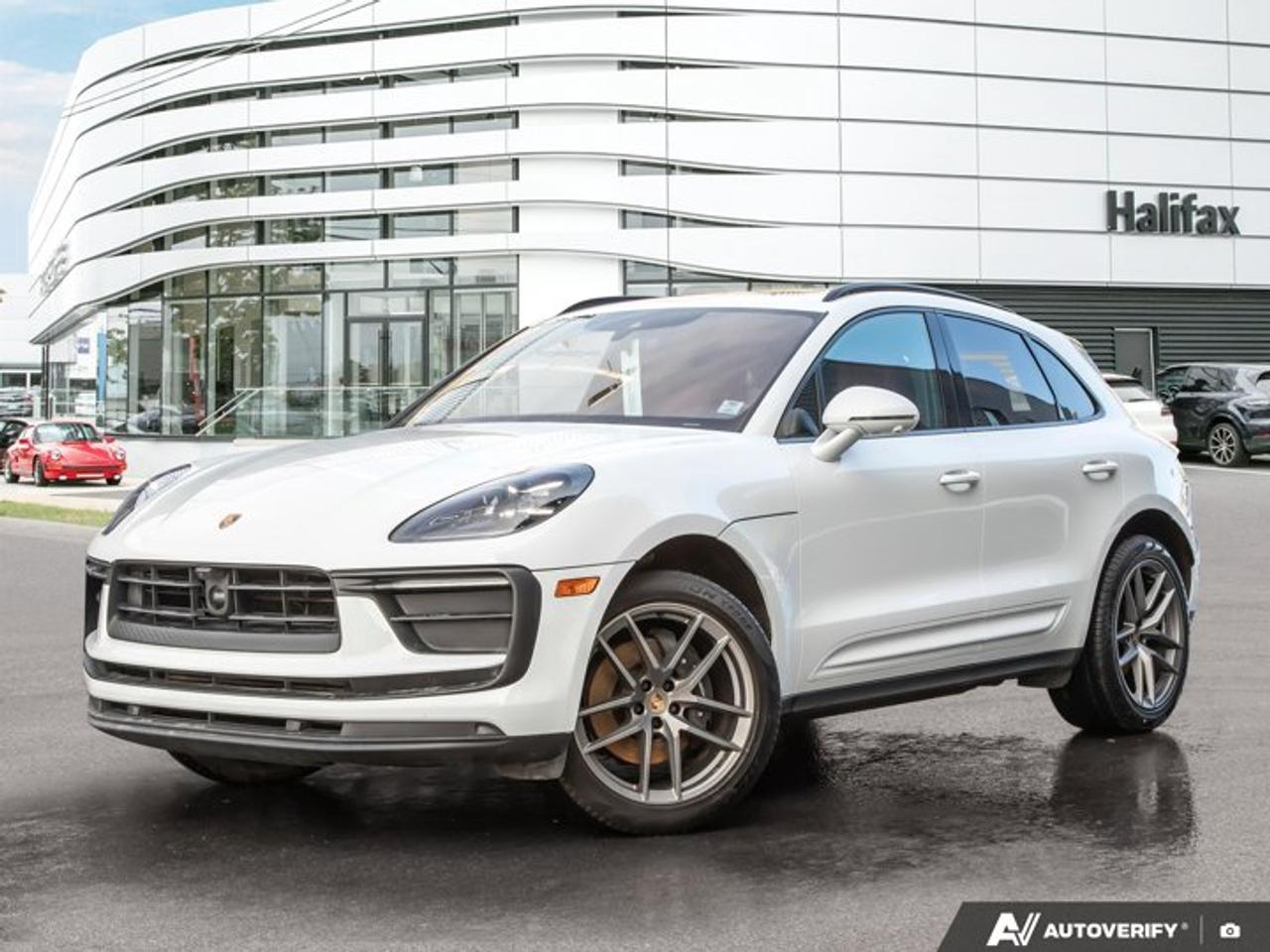 Now available at Porsche of Halifax, this *2023 Porsche Macan* is finished in *Carrara White Metallic* with a *Leather Package in Black/Bordeaux Red*. The vehicle is equipped with Premium Package Plus along with a range of comfort and driver-assistance features suited for everyday use.*Included with this Porsche CPO Program Vehicle:*  * *2 years of Unlimited-Kilometer Porsche Approved Warranty Coverage, starting April, 2027. *  * *A 111-Point Inspection performed by Porsche-trained technicians, using only genuine Porsche Parts.*  * *For the duration of the Warranty period, 24-hour Porsche Roadside Assistance, including towing, emergency fuel delivery, lock out service, trip interruption coverage, and more.*==== Performance & Driving ====  *   *PDK Automatic Transmission* -- smooth and responsive gear changes  *   *Porsche-tuned suspension* -- balanced ride comfort and handling  *   *20 Macan S wheels in Vesuvius Grey* with all-season tires -- suitable for year-round driving==== Interior & Comfort ====  *   *Leather Package in Black/Bordeaux Red* -- contrasting interior finish  *   *14-way power seats with memory* -- adjustable driver and passenger positioning  *   *Ventilated front seats* -- added comfort in warmer conditions  *   *Heated rear seats* -- improved passenger comfort in colder weather  *   *Heated GT Sport steering wheel *-- increased comfort during winter driving  *   *Panoramic roof system *-- additional natural light in the cabin  *   *Heated windshield* -- improved visibility in cold conditions  *   *Porsche crest on front headrests* -- interior detailing==== Technology & Driver Assistance ====  *   *LED headlights with Porsche Dynamic Light System Plus *(PDLS+) -- adaptive lighting response  *   *Lane Change Assist (LCA)* -- monitors adjacent lanes  *   *Adaptive Cruise Control (ACC)* -- maintains set distance from vehicles ahead  *   *Surround View camera system* -- assists with parking and maneuvering  *   *Inductive charging storage compartment* -- wireless charging capability  *   *Preparation for Porsche Dashcam* (front)==== Exterior Details ====  *   Side blades in exterior colour  *   Roof rails in High Gloss Black  *   Trailer hitch (without tow ball)  *   Exclusive Design fuel cap  *   Under-door puddle light projectorsThis Macan is configured with a combination of practical driver-assistance systems and comfort features, along with distinctive two-tone interior trim and 20-inch wheels for balanced daily usability.*Connect with* us for more details or to arrange a test-drive with a* Porsche Brand Ambassador* at www.porscheofhalifax.com or *902-453-8800*.