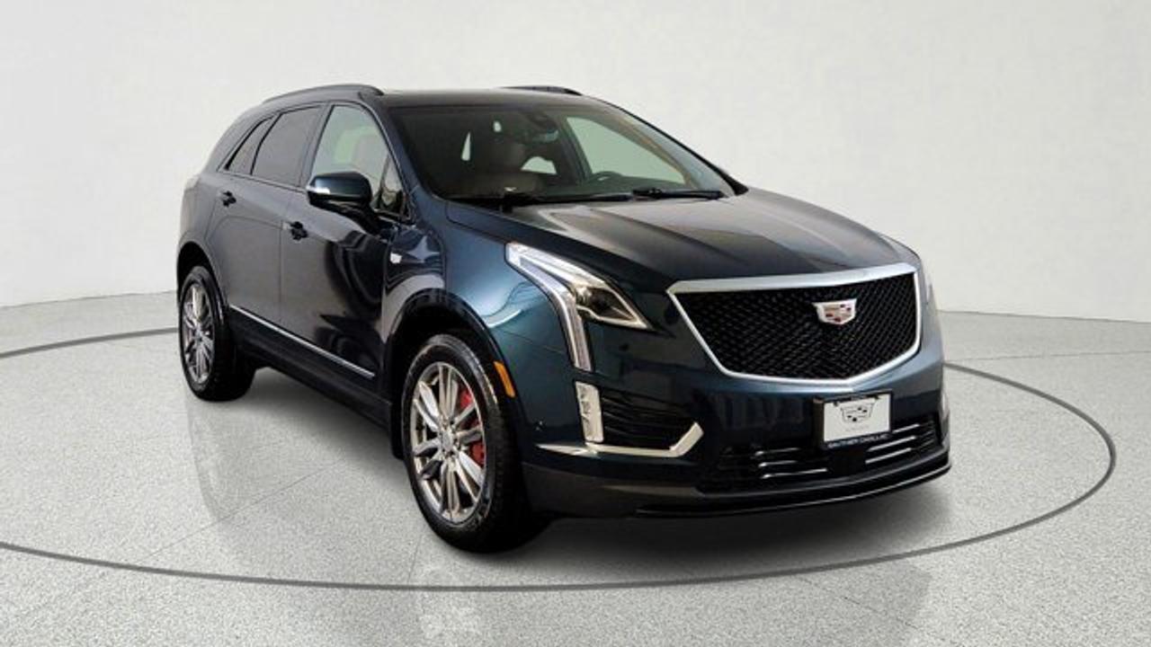 The 2026 Cadillac XT5 AWD Sport is a performance-oriented version of Cadillacs luxury mid-size SUV. It pairs a potent 3.6 L V6 engine with a 9-speed automatic transmission and twin-clutch Sport Control all-wheel drive for stronger acceleration and confident handling. It stands out with sport-tuned suspension (Chassis Damping Control and yaw control), Brembo performance brakes with red calipers, 20-inch 12-spoke alloy wheels, gloss black accents, and premium features like tri-zone climate control and advanced driver-assistance tech for comfort and capability on varied roads. Inside, the Sport trim blends comfort and connectivity with features such as heated/ventilated seats, wireless smartphone integration navigation and safety systems.