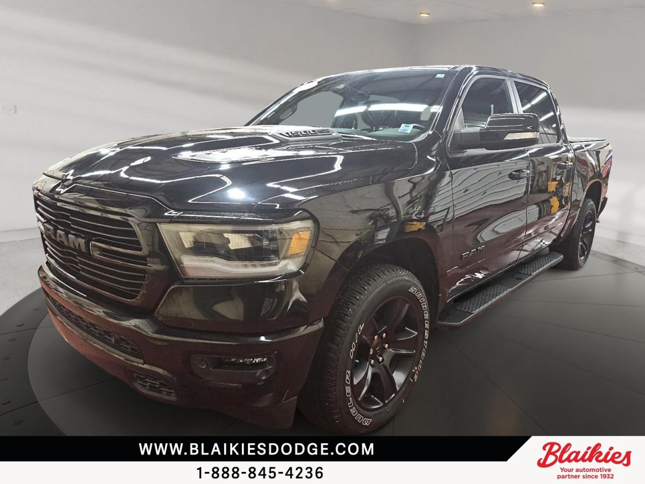 2021 Ram 1500 Sport | HEMI Power Blacked Out Style

Short Paragraph:
This 2021 Ram 1500 Sport delivers powerful performance with its 5.7L HEMI V8 and capable 4x4 drivetrain. With 76,953 kilometres, this black on black pickup combines bold styling, advanced technology, and impressive towing capability for work or everyday driving.

Key Features:

5.7L HEMI V8 engine with FuelSaver MDS

Uconnect 4 system with 8.4-inch touchscreen

Apple CarPlay and Android Auto compatibility

Heated front seats and heated steering wheel

Sport performance hood with black dual exhaust tips

ParkSense front and rear park assist with backup camera

This Ram 1500 is ready for any journey, blending performance, comfort, and modern features. Contact Blaikies Dodge for more details or to schedule a test drive today. Enjoy the convenience of viewing a free CarFax report without submitting personal information. Visit Blaikies Dodge for more details or click to schedule a test drive!