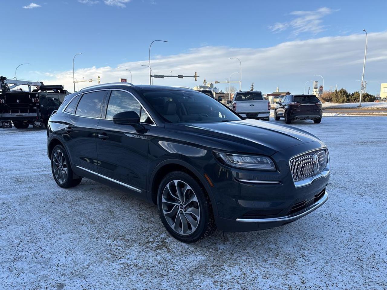 THE PRICE YOU SEE, PLUS GST. GUARANTEED!APPLE CARPLAY/ANDROID AUTO COMPATABLE! 2.0 LITER ECOBOOST ENGINE, 8 SPEED AUTO, RESERVE TRIM(201a), SLATE GREY LEATHER SEATS, HEATED FRONT SEATS, PANORAMIC ROOF, LINCOLN CO-PILOT 360, CARGO UTILITY PKG, SYNC 4.     The 2022 Lincoln Nautilus Reserve with the 2.0-liter engine is a sophisticated and refined midsize luxury SUV that emphasizes comfort, technology, and elegant design. Powered by a turbocharged 2.0-liter four-cylinder engine, it provides a balanced mix of smooth performance and efficiency, delivering around 250 horsepower and responsive acceleration suitable for urban and highway driving. The 201A Package enhances the Nautilus Reserve with a host of premium features, including a high-resolution touchscreen infotainment system with navigation, Apple CarPlay and Android Auto integration, and a premium sound system that elevates the in-cabin audio experience. The package also typically includes luxurious interior appointments such as leather upholstery, heated and ventilated seats, and advanced driver-assistance systems like adaptive cruise control, lane-keeping assist, and a 360-degree camera for added safety and convenience. The exterior design exudes elegance with sleek lines, a distinctive grille, and tasteful chrome accents, while the interior offers a quiet, plush environment with high-quality materials and modern conveniences. Overall, the 2022 Lincoln Nautilus Reserve with the 2.0-liter engine and 201A Package is an ideal choice for those seeking a luxury SUV that combines sophisticated styling, cutting-edge technology, and a comfortable ride.Do you want to know more about this vehicle, CALL, CLICK OR COME ON IN!*AMVIC Licensed Dealer; CarFax and Full Mechanical Inspection Included.
