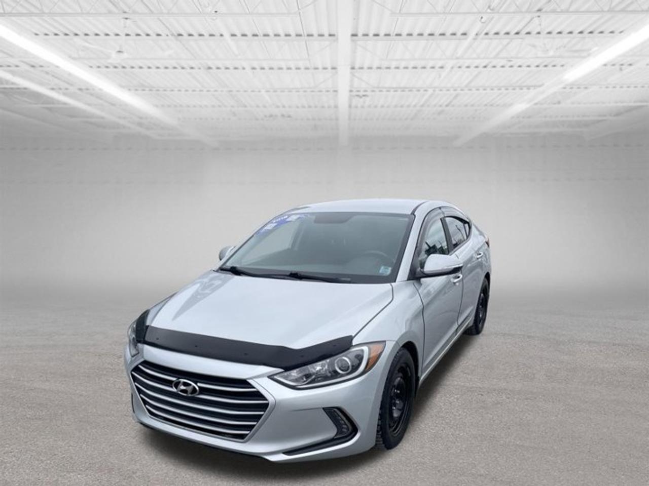 The 2018 Hyundai Elantra GL offers a smooth, comfortable, and efficient driving experience making it an excellent choice for commuters, first time buyers, and anyone seeking a dependable sedan. Powered by a responsive automatic transmission, the Elantra delivers easy, confident performance whether youre navigating city streets or cruising on the highway.Inside, the GL trim provides a well equipped cabin with sought after features including heated front seats, a heated steering wheel, a backup camera, and a user friendly touchscreen. Its spacious interior layout and supportive seating ensure comfort for both the driver and passengers.With its sleek exterior styling, impressive fuel efficiency, and Hyundais reputation for long term reliability, the 2018 Elantra GL stands out as a smart, practical, and value packed compact sedan.