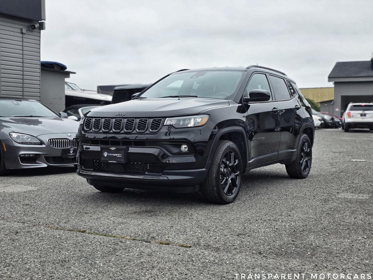 Transparent Motorcars is pleased to offer this beautiful 2024 Jeep Compass Altitude 4x4 With 1762kms ONLY, Clean Carfax, Brand New Car Condition! It Features 200 Horsepower 2.0L Turbocharged Engine Paired With Jeep 4x4 All-Wheel-Drive System, 18inch Gloss Black Aluminum Wheels, AllBlack Interior With Vinyl & LeatherTrimmed Seats, Navigation System, WiFi Hotspot, Heated Front Seats, Heated Steering Wheel, Remote Start System, LED Headlights, SelecTerrain Traction Management System, Keyless Enter n Go With Proximity Entry, Back-Up Camera, Wireless Apple Carplay & Android Auto And Much More! <br/> <br/> <br/> <br/> <br/> Stock# F000402J Dealer#50276 <br/> <br/> <br/> $595 Documentation Fee <br/> <br/> <br/> This vehicle has undergone a comprehensive 110-point inspection at our state-of-the-art service facility, covering: Powertrain, Suspension, Tire Tread Depth ,Brake Condition ,All Electrical Components <br/> <br/> <br/> *Each vehicle comes with a limited warranty for your peace of mind. <br/> <br/> <br/> *Free, full CARFAX Vehicle History Report available upon request. <br/> <br/> <br/> *We are a 5-star rated Google dealership, trusted by our customers. <br/> <br/> <br/> *Thousands of satisfied customers  we invite you to join our automotive family! <br/> <br/> <br/> *Complimentary pick-up service from the airport, ferry terminal, or SkyTrain station is available. <br/> <br/> <br/> *For details on our refund and buyback policy, please contact our team directly. <br/> <br/> <br/> At our dealership, we pride ourselves on building lasting relationships with our customers. Were not just a one-time dealer  we are committed to being your trusted partner for all your vehicle needs, now and in the future. From your initial purchase to ongoing service, we aim to exceed expectations every step of the way. <br/>