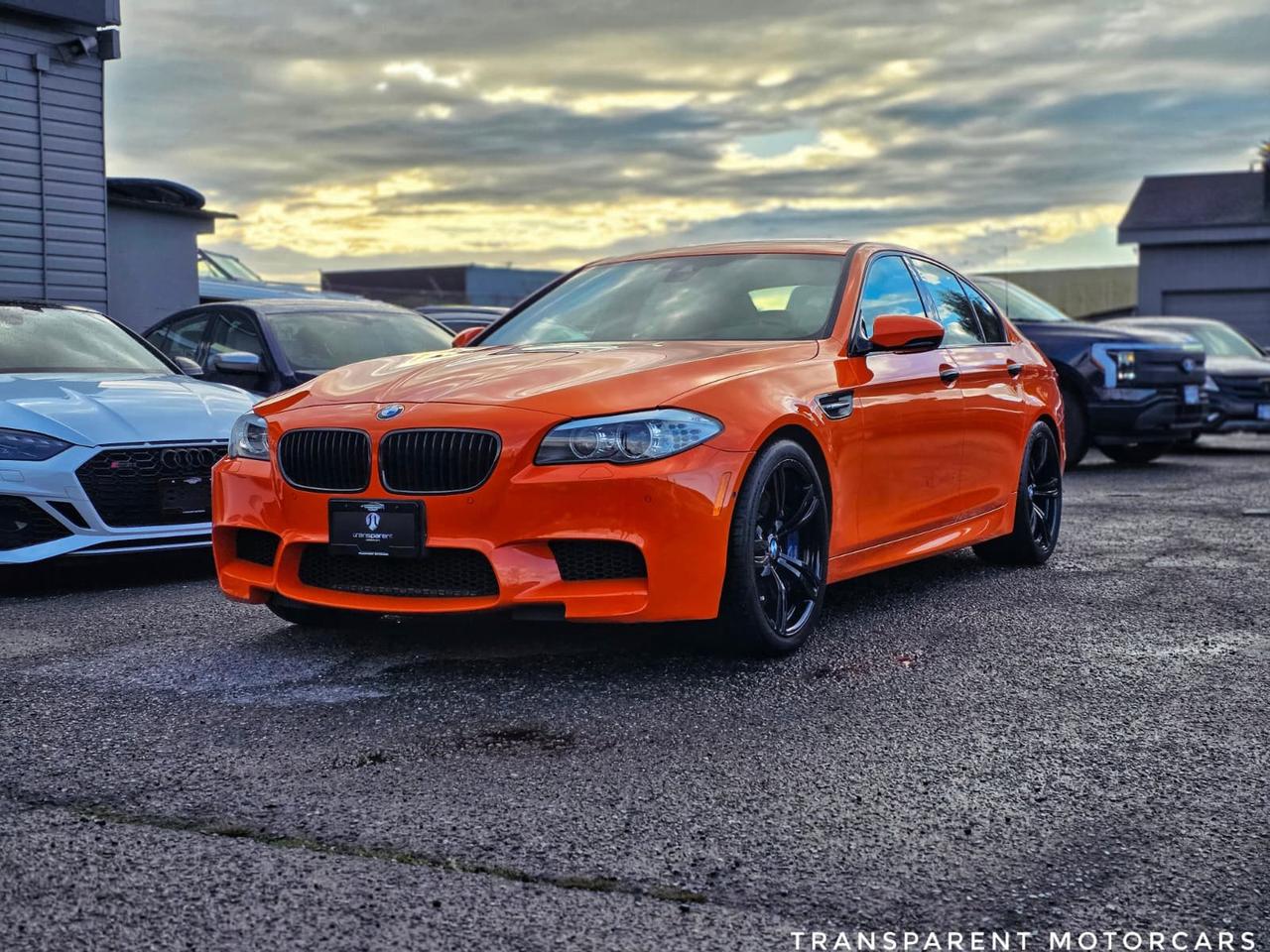 Transparent Motorcars is pleased to offer this beautiful Fire Orange 2013 BMW M5 With 92,063kms! It Features 560 Horsepower V8 Turbo Engine Paired With 7-Speed Automated Transmission, Executive Package, Electric Rear Sunshade, Automatic Trunk, Soft Close Doors, Ventilated Seats, Head-Up Display, M Multi-Function Seats, Lane Departure Warning, SIRIUS Satellite Radio Tuner, Active Blind Spot Detection, Surround View, Active Seat for Driver and Front Passenger, Smartphone Integration, BMW Apps, Side Sunshades, High-Beam Assistant, BMW Individual Reading Lights, Dual Zone Climate Control, Keyless Entry, Keyless Start, Navigation And Much More! <br/> <br/> <br/> Stock# F000481B Dealer # 50276 <br/> <br/> <br/> $995 Documentation Fee <br/> <br/> <br/> 3771 No.3 Road Richmond/4211 No.3 Road Richmond <br/> <br/> <br/> This vehicle has undergone a comprehensive 110-point inspection at our state-of-the-art service facility, covering: Powertrain, Suspension, Tire Tread Depth ,Brake Condition ,All Electrical Components <br/> <br/> <br/> *Each vehicle comes with a limited warranty for your peace of mind. <br/> <br/> <br/> *Free, full CARFAX Vehicle History Report available upon request. <br/> <br/> <br/> *We are a 5-star rated Google dealership, trusted by our customers. <br/> <br/> <br/> *Thousands of satisfied customers  we invite you to join our automotive family! <br/> <br/> <br/> *Complimentary pick-up service from the airport, ferry terminal, or SkyTrain station is available. <br/> <br/> <br/> *For details on our refund and buyback policy, please contact our team directly. <br/> <br/> <br/> At our dealership, we pride ourselves on building lasting relationships with our customers. Were not just a one-time dealer  we are committed to being your trusted partner for all your vehicle needs, now and in the future. From your initial purchase to ongoing service, we aim to exceed expectations every step of the way. <br/>