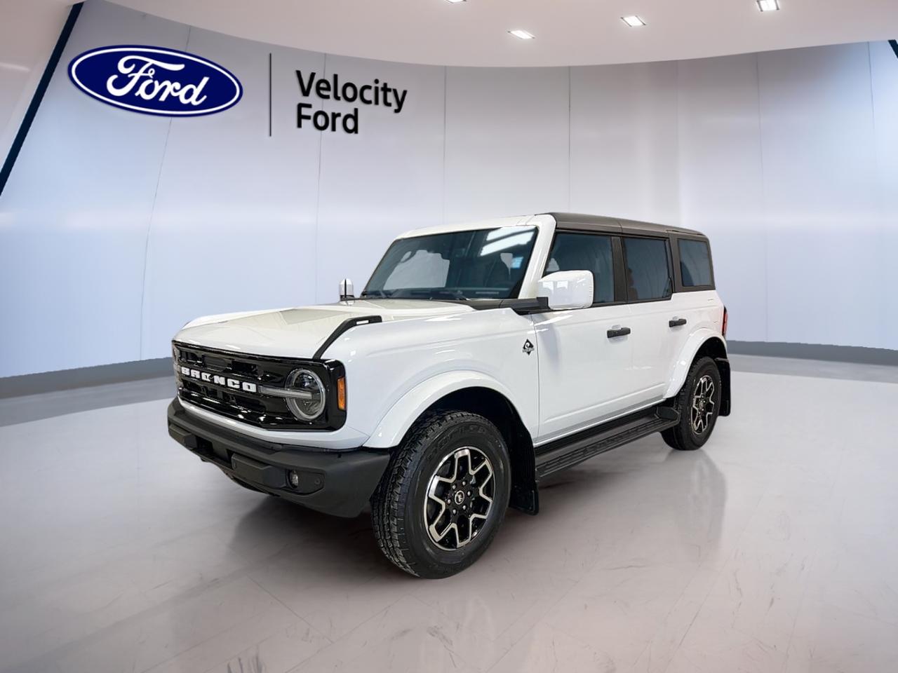 Meet the brand new 2026 Ford Bronco Outer Banks 4 Door 4x4, now at Velocity Ford in Moose Jaw. Finished in white with a black interior, this 4-door SUV blends open-air fun with everyday comfort. With a 2.7 L unleaded engine and an automatic transmission, its ready for prairie highways, city errands, and weekend escapes.

Built for drivers who want real capability without giving up convenience, the 2026 Ford Bronco Outer Banks 4 Door 4x4 brings confident 4WD traction, smart driver-assist tech, and a premium feel you can enjoy year-round. From cold mornings to summer road trips, its equipped to make every drive easier and more enjoyable.

FEATURES OF THE Bronco Outer Banks 4 Door 4x4  
»» Convertible roof for open-air driving  
»» Four-wheel drive for all-season traction  
»» Off-road tires for confident grip  
»» Rear tow hook for recovery support  

ADVANCED SAFETY FEATURES  
»» Anti-lock braking system for controlled stops  
»» Stability control helps maintain vehicle balance  
»» Blind spot monitor for safer lane changes  
»» Lane departure warning adds extra awareness  

PERFORMANCE AND EFFICIENCY  
»» 2.7 L unleaded engine power  
»» Automatic transmission with dual shift mode  
»» Four-wheel drive for varied road conditions  
»» Power steering for easy low-speed control  

COMFORT AND CONVENIENCE  
»» Dual-zone automatic climate control for comfort  
»» Heated front seats for cold days  
»» Remote starter for quick warmups  
»» Power windows and automatic door locks  

TECHNONOLGY AND CONNECTIVITY  
»» Navigation system helps plan every route  
»» Bluetooth integration for hands-free calling  
»» WiFi hotspot helps keep devices connected  
»» Steering wheel audio controls within reach  

CARGO SPACE  
»» Rear trunk access for easy loading  
»» Spare tire onboard for added confidence  
»» Four-door layout aids passenger entry  
»» Tinted windows help protect stored items  

WHAT OTHER OWNERS LIKE  
»» Confident 4WD feel in bad weather  
»» Easy-to-use infotainment and navigation features  
»» Strong visibility with backup camera  
»» Heated mirrors for winter convenience  

This Bronco also includes key essentials for daily driving, like a backup camera, automatic headlights, LED headlamps, fog lights, tire pressure monitoring, and a full airbag suite including driver, passenger, side impact, and head side airbags. Convenience is covered with push-button start, an auto-dimming rearview mirror, heated mirrors, power mirrors, and drivers seat lumbar support. For comfort and control, you also get cruise control, an adjustable steering wheel, and driver and passenger power seats.

This 2026 Ford Bronco Outer Banks 4 Door 4x4s VIN is: 1FMEE8BP8TLA60560.
