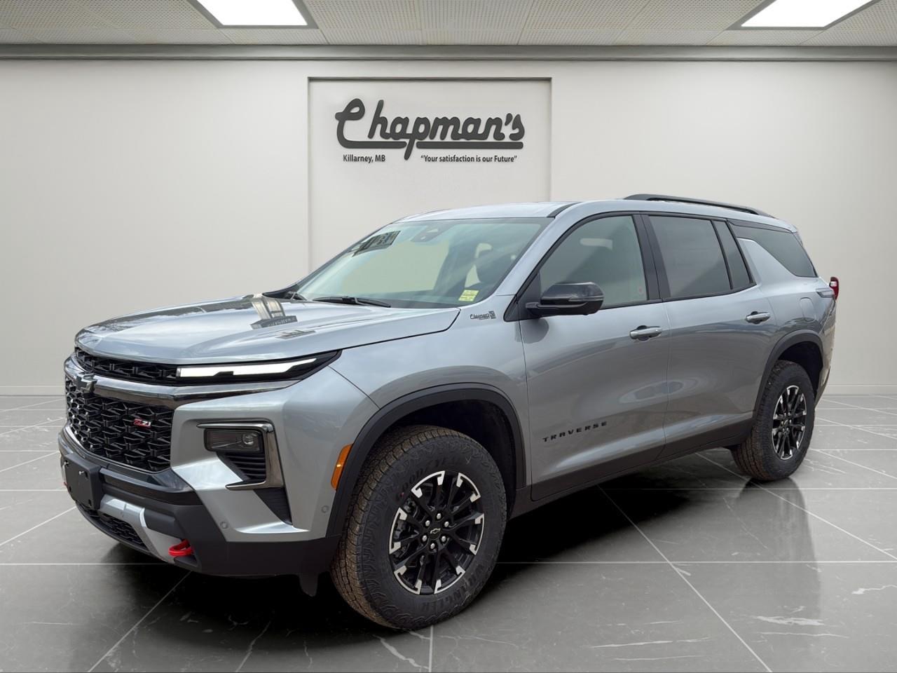 <p>Rugged capability meets family-ready versatility in this <strong>2026 Chevrolet Traverse Z71 AWD</strong>, finished in <strong>Sterling Grey Metallic with a Jet Black Evotex interior featuring red accents</strong>. Designed for drivers who want off-road confidence without sacrificing comfort or space, the Traverse Z71 delivers bold styling, advanced technology, and seating for the whole crew.</p><p>Powered by a <strong>2.5L Turbocharged DOHC engine paired with an 8-speed automatic transmission</strong>, this Traverse offers strong performance and smooth power delivery. The <strong>Advanced Twin-Clutch AWD system and Hill Descent Control</strong> provide enhanced traction and control when road conditions get challenging, while Z71-specific suspension and all-terrain tires give it true adventure-ready capability.</p><p>Inside, the spacious <strong>7-passenger cabin</strong> is equipped with modern comfort and convenience features including <strong>heated front seats, a heated steering wheel, wireless phone charging, and an 11" driver information display</strong>. The <strong>AutoSense power liftgate, remote start, and multiple USB ports across all rows</strong> make this SUV ideal for busy families and long road trips.</p><h3><strong>Performance & Capability</strong></h3><p>Built for confident performance on and off the road.</p><ul><li><p>2.5L Turbocharged DOHC Engine</p></li><li><p>8-Speed Automatic Transmission</p></li><li><p>Advanced Twin-Clutch All-Wheel Drive</p></li><li><p>Hill Descent Control</p></li><li><p>Special Ride & Handling Suspension</p></li><li><p>All-Terrain Tires</p></li><li><p>Trailering Equipment with Hitch View & Guidance</p></li></ul><h3><strong>Interior Comfort & Convenience</strong></h3><p>Spacious interior designed for comfort and versatility.</p><ul><li><p>7-Passenger Seating</p></li><li><p>Heated Front Seats</p></li><li><p>Heated Steering Wheel</p></li><li><p>8-Way Power Driver Seat</p></li><li><p>AutoSense Power Liftgate</p></li><li><p>Wireless Phone Charging</p></li><li><p>120V Power Outlet</p></li><li><p>Remote Vehicle Start</p></li></ul><h3><strong>Technology & Connectivity</strong></h3><p>Modern tech designed to keep everyone connected.</p><ul><li><p>11" Driver Information Centre Display</p></li><li><p>SiriusXM Radio Capability</p></li><li><p>OnStar Basics (Up to 8 Years)</p></li><li><p>Six USB Ports (Two Per Row)</p></li><li><p>Active Noise Cancellation</p></li></ul><h3><strong>Safety & Driver Assistance</strong></h3><p>Advanced safety features for added peace of mind.</p><ul><li><p>HD Surround Vision</p></li><li><p>Rear Camera Mirror</p></li><li><p>Rear Pedestrian Alert</p></li><li><p>Traffic Sign Recognition</p></li><li><p>Forward Collision Alert</p></li><li><p>Enhanced Automatic Emergency Braking</p></li><li><p>Side Bicyclist Alert</p></li><li><p>Following Distance Indicator</p></li></ul><h3><strong>Exterior Highlights</strong></h3><p>Bold Z71 styling with rugged design elements.</p><ul><li><p>Sterling Grey Metallic Exterior</p></li><li><p>High Gloss Black Grille</p></li><li><p>18" Black Machined Aluminum Wheels</p></li><li><p>All-Terrain Tires</p></li><li><p>Hitch Guidance with Hitch View</p></li><li><p>Roof Rails</p></li></ul><p>With rugged Z71 capability, advanced safety technology, spacious seating for seven, and modern convenience features, this <strong>2026 Chevrolet Traverse Z71 AWD</strong> is ready for family adventures, daily driving, and everything in between.</p><p>2 Year/24,000 kilometer* Complimentary Oil Changes (2 total)</p><p>3 Year/60,000 kilometer* Base Warranty Coverage</p><p>5 Year/100,000 kilometer* Powertrain Component Warranty Coverage</p><p>5 Year/100,000 kilometer* Courtesy Transportation and 24/7 Roadside Assistance</p><p>6 Year/160,000 kilometer* Sheet Metal (Rust Through) Perforation Warranty Coverage</p><p>*Whichever Comes First.</p><p>Price Includes Dealer Fee.</p><p>Price Excludes PST & GST.</p><p>Financing Options Available, Call For More Details.</p> <p><strong>*While every reasonable effort is made to ensure the accuracy of this information, we are not responsible for any error or omissions contained on these pages. Please verify any information in question with Chapman Motors Ltd.</strong></p>