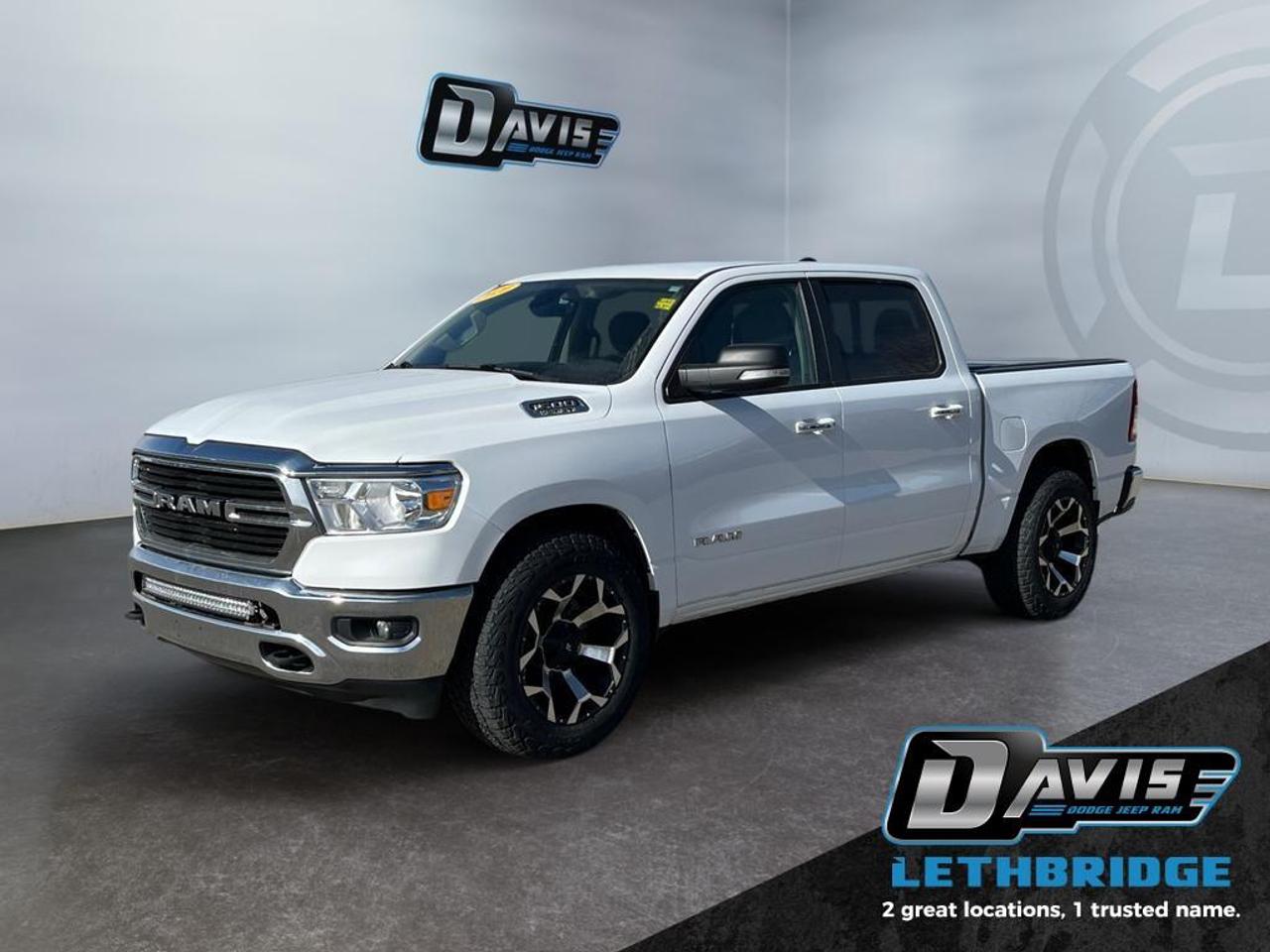<b>Aluminum Wheels, Chrome Accents, Proximity Key, Touchscreen, Streaming Audio!</b><br /> <br /> Beauty meets brawn with this rugged Ram 1500. This 2020 Ram 1500 is fresh on our lot in Lethbridge. <br /> <br />The Ram 1500 delivers power and performance everywhere you need it, with a tech-forward cabin that is all about comfort and convenience. Loaded with best-in-class features, it's easy to see why the Ram 1500 is so popular. With the most towing and hauling capability in a Ram 1500, as well as improved efficiency and exceptional capability, this truck has the grit to take on any task. This Crew Cab 4X4 pickup has 170,830 km. Stock number 41271 is White in colour. It has an Automatic transmission and is powered by a 395HP 5.7L 8 Cylinder Engine. <br /> <br /> Our 1500's trim level is Big Horn. This Ram 1500 Big Horn comes very well equipped with stylish aluminum wheels, comfortable cloth seats and premium carpet floors, a leather steering wheel, Uconnect with a large touchscreen, wireless streaming audio, USB input jacks, and a useful rear view camera. This awesome pickup truck also includes power heated side mirrors, proximity keyless entry, cruise control, an HD suspension, towing equipment, chrome bumpers with rear step, chrome exterior accents, fog lights and much more. This vehicle has been upgraded with the following features: Aluminum Wheels, Chrome Accents, Proximity Key, Touchscreen, Streaming Audio, Rear Camera, Cruise Control.<br /> <br />To apply right now for financing use this link: <a href=https://lethbridge.davisdodge.ca/free-credit-check/ target=_blank rel=nofollow noopener noreferrer>https://lethbridge.davisdodge.ca/free-credit-check/</a><br /><br /> <br /><br />Locally Owned & Trusted for Over 35 Years  Davis Dodge in Lethbridge, AB <br /><br /> At Davis Dodge, weve proudly served the Lethbridge community for more than 35 years, offering an unparalleled car buying experience. Dont just take our word for itour Google reviews speak volumes about our commitment to exceptional service. <br /><br /> Delivery & At-Home Test Drives: Convenient options to suit your lifestyle. <br /><br /> Flexible Financing for Everyone: Get the vehicle you need with financing solutions tailored to your situation. <br /><br /> Full Mechanical Inspections & Professional Cleaning: Every vehicle is thoroughly inspected and cleaned before it hits our lot.<br /><br /> We take all makes and models on trade and offer competitive pricing with inventory that changes daily. Whether you're shopping for a Chrysler, Dodge, Jeep, RAM, or FIAT, our AMVIC Licensed dealership makes it easy to browse, buy, and drive away.<br /><br /> Located in Lethbridge, AB, we proudly serve customers in Fort Macleod, Taber, Claresholm, and Coaldale. Shop online or visit us today to experience the best in sales, service, and selection. Standard bank rates apply; taxes are additional.<br /><br /> Vehicle pricing offer shown expires 2026-04-30. <br /> Come by and check out our fleet of 70+ used cars and trucks and 130+ new cars and trucks for sale in Lethbridge. o~o