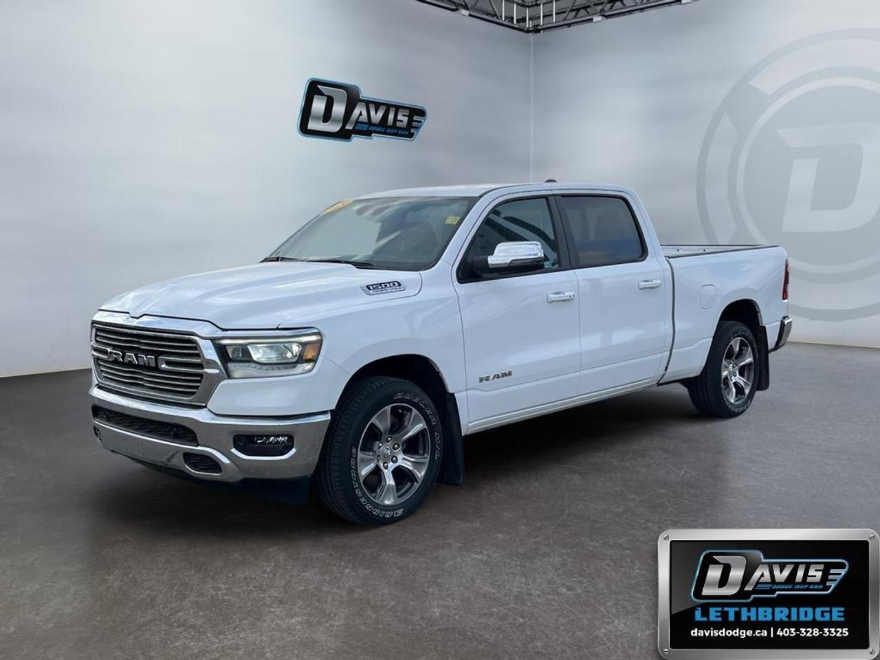 <b>Low Mileage, Navigation, Remote Start, 4G Wi-Fi, Heated Steering Wheel!<br /> <br /></b><br /> The 2023 Ram 1500 Laramie 4x4 Crew Cab delivers a perfect blend of power, luxury, and capability, making it an ideal full-size truck for both work and everyday driving. Equipped with a proven 5.7L HEMI V8 engine with eTorque and an 8-speed automatic transmission, this Ram provides strong towing performance and smooth acceleration. With its electronic shift-on-demand 4WD system, 3.92 rear axle ratio, and engine block heater, its built to handle tough Canadian conditions with confidence year-round.<br /><br />Inside, the Laramie trim offers a refined cabin loaded with premium features designed for comfort and convenience. Leather-trimmed seating, heated and ventilated front seats, a heated steering wheel, and power-adjustable seats with memory ensure a first-class driving experience. The Laramie Level 1 Equipment Group enhances functionality with remote start, rain-sensing windshield wipers, and a power sliding rear window, while the spacious Crew Cab and 6-foot box provide excellent versatility for passengers and cargo alike.<br /><br />Technology and safety are at the forefront with a large 12-inch touchscreen featuring the Uconnect 5 NAV system, offering Apple CarPlay, Android Auto, built-in navigation, SiriusXM 360L, and a 4G LTE Wi-Fi hotspot. A premium 9-speaker audio system with subwoofer delivers impressive sound quality, while advanced safety features such as Blind Spot Monitoring, ParkSense front and rear park assist with stop, Forward Collision Warning with Active Braking, and a ParkView rear backup camera provide added peace of mind. Finished in Bright White with 20-inch aluminum wheels and chrome accents, this Ram 1500 Laramie stands out with both style and capability.<br /> <br />To apply right now for financing use this link: <a href=https://lethbridge.davisdodge.ca/free-credit-check/ target=_blank rel=nofollow noopener noreferrer>https://lethbridge.davisdodge.ca/free-credit-check/</a><br /> <br /><br />Locally Owned & Trusted for Over 35 Years  Davis Dodge in Lethbridge, AB <br /><br /> At Davis Dodge, weve proudly served the Lethbridge community for more than 35 years, offering an unparalleled car buying experience. Dont just take our word for itour Google reviews speak volumes about our commitment to exceptional service. <br /><br /> Delivery & At-Home Test Drives: Convenient options to suit your lifestyle. <br /><br /> Flexible Financing for Everyone: Get the vehicle you need with financing solutions tailored to your situation. <br /><br /> Full Mechanical Inspections & Professional Cleaning: Every vehicle is thoroughly inspected and cleaned before it hits our lot.<br /><br /> We take all makes and models on trade and offer competitive pricing with inventory that changes daily. Whether you're shopping for a Chrysler, Dodge, Jeep, RAM, or FIAT, our AMVIC Licensed dealership makes it easy to browse, buy, and drive away.<br /><br /> Located in Lethbridge, AB, we proudly serve customers in Fort Macleod, Taber, Claresholm, and Coaldale. Shop online or visit us today to experience the best in sales, service, and selection. Standard bank rates apply; taxes are additional.<br /><br /> Vehicle pricing offer shown expires 2026-06-30. <br /> Come by and check out our fleet of 50+ used cars and trucks and 110+ new cars and trucks for sale in Lethbridge. o~o