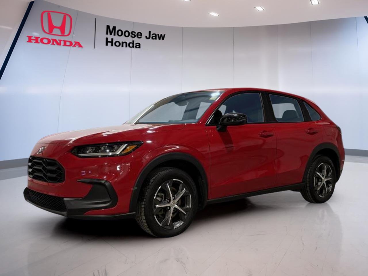 Meet the used 2023 Honda HR-V Sport, now at Moose Jaw Honda in Moose Jaw. Finished in a bold red, this compact SUV is a smart fit for daily driving, weekend plans, and everything in between. With 69,000 km on the odometer and an automatic transmission, its ready for steady, easy commuting with the elevated view and flexibility SUV drivers want.

The 2023 Honda HR-V Sport is designed for real life in Saskatchewan. Its easy to place in traffic, simple to park, and comfortable for long stretches of highway. The HR-V Sport also brings a more athletic look to the HR-V lineup, giving you a confident presence without giving up the practical side that makes this model such a popular choice.

At Moose Jaw Honda, we know used SUV shoppers want value you can feel every day. This 2023 Honda HR-V Sport delivers with a clean, modern shape, a practical cabin layout, and the kind of driving manners that make errands and road trips less tiring. If you want a compact SUV that feels composed and sensible, this HR-V Sport belongs on your shortlist.

FEATURES OF THE HR-V Sport  
»» Sport-styled exterior design and trim  
»» Compact SUV size, easy to park  
»» Automatic transmission for smooth daily driving  
»» Versatile layout for everyday utility  

ADVANCED SAFETY FEATURES  
»» Designed for confident, predictable road manners  
»» Solid visibility from an SUV seating position  
»» Stable feel for city and highway  
»» Built for everyday driving peace of mind  

PERFORMANCE AND EFFICIENCY  
»» Automatic transmission for simple operation  
»» Easy acceleration for merging and passing  
»» Compact footprint helps reduce driving stress  
»» Well-suited for urban and highway routes  

COMFORT AND CONVENIENCE  
»» Practical cabin layout with smart storage  
»» Comfortable seating position for daily commutes  
»» Easy in-and-out access for passengers  
»» Controls placed for quick, simple use  

TECHNONOLGY AND CONNECTIVITY  
»» Straightforward infotainment layout, easy to learn  
»» Clear driver information display for key data  
»» Convenient in-cabin charging and device support  
»» Simple controls reduce distraction while driving  

CARGO SPACE  
»» Cargo area suited for daily errands  
»» Room for groceries, bags, and gear  
»» Flexible space for weekend activities  
»» Practical SUV utility in compact size  

WHAT OTHER OWNERS LIKE  
»» Easy-to-drive size for busy cities  
»» Practical cargo space for daily life  
»» Comfortable ride for longer commutes  
»» Sporty look without sacrificing usefulness  

This 2023 Honda HR-V Sports VIN is: 3CZRZ2H54PM105795.<p> easy commuting with the elevated view and flexibility SUV drivers want.

The 2023 Honda HR-V Sport is designed for real life in Saskatchewan. Its easy to place in traffic</p>
<p> and comfortable for long stretches of highway. The HR-V Sport also brings a more athletic look to the HR-V lineup</p>
<p> giving you a confident presence without giving up the practical side that makes this model such a popular choice.

At Moose Jaw Honda</p>
<p> we know used SUV shoppers want value you can feel every day. This 2023 Honda HR-V Sport delivers with a clean</p>
<p> and the kind of driving manners that make errands and road trips less tiring. If you want a compact SUV that feels composed and sensible</p>
<p> this HR-V Sport belongs on your shortlist.

FEATURES OF THE HR-V Sport  
»» Sport-styled exterior design and trim  
»» Compact SUV size</p>
<p> easy to park  
»» Automatic transmission for smooth daily driving  
»» Versatile layout for everyday utility  

ADVANCED SAFETY FEATURES  
»» Designed for confident</p>
<p> predictable road manners  
»» Solid visibility from an SUV seating position  
»» Stable feel for city and highway  
»» Built for everyday driving peace of mind  

PERFORMANCE AND EFFICIENCY  
»» Automatic transmission for simple operation  
»» Easy acceleration for merging and passing  
»» Compact footprint helps reduce driving stress  
»» Well-suited for urban and highway routes  

COMFORT AND CONVENIENCE  
»» Practical cabin layout with smart storage  
»» Comfortable seating position for daily commutes  
»» Easy in-and-out access for passengers  
»» Controls placed for quick</p>
<p> easy to learn  
»» Clear driver information display for key data  
»» Convenient in-cabin charging and device support  
»» Simple controls reduce distraction while driving  

CARGO SPACE  
»» Cargo area suited for daily errands  
»» Room for groceries</p>
<p> and gear  
»» Flexible space for weekend activities  
»» Practical SUV utility in compact size  

WHAT OTHER OWNERS LIKE  
»» Easy-to-drive size for busy cities  
»» Practical cargo space for daily life  
»» Comfortable ride for longer commutes  
»» Sporty look without sacrificing usefulness  

This 2023 Honda HR-V Sports VIN is: 3CZRZ2H54PM105795.</p>