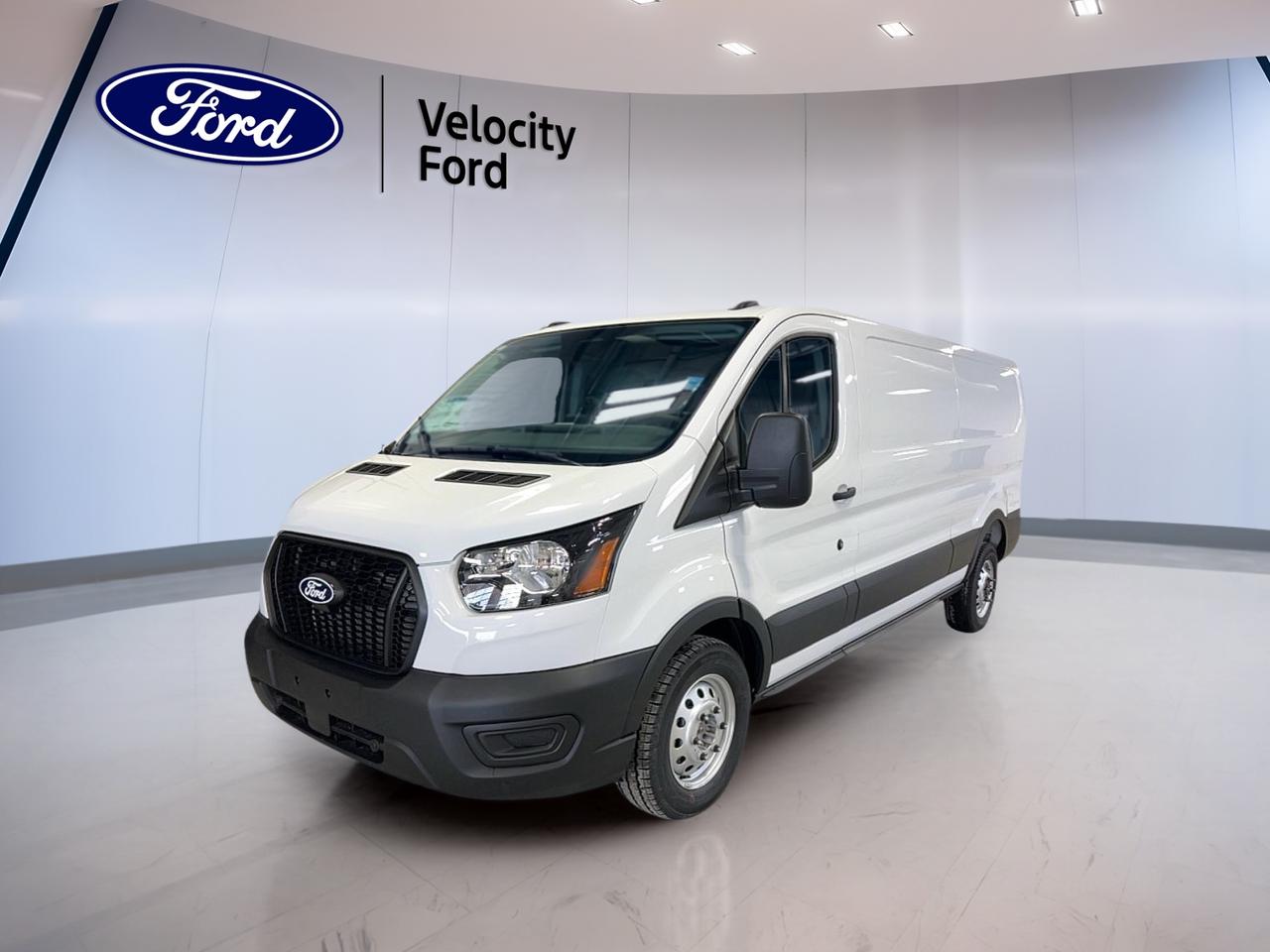 The 2026 Ford Transit Cargo Van T-150 130 Low Rf AWD is built for hard work and daily dependability. This brand new van at Velocity Ford in Moose Jaw pairs a clean White exterior with a Dark grey interior and a practical 3-door layout. Its low roof design helps with access in urban spaces, while all-wheel drive adds confidence in changing Prairie weather.

Powered by a 3.5-litre unleaded engine and automatic transmission, the 2026 Ford Transit Cargo Van T-150 130 Low Rf AWD delivers the strong, steady performance many businesses need. This setup is well suited for deliveries, service work, and mobile trade use. It is easy to drive, simple to enter, and ready to support demanding commercial routines.

FEATURES OF THE Transit Cargo Van T-150 130 Low Rf AWD
»» Low roof suits parkades and garages
»» All-wheel drive adds year-round traction
»» 130-inch wheelbase balances space, agility
»» Three-door design supports easy cargo access

ADVANCED SAFETY FEATURES
»» Anti-Lock Braking System helps controlled stops
»» Stability Control supports confident handling
»» Backup camera aids reversing visibility
»» Lane Departure Warning adds extra awareness

The 2026 Ford Transit Cargo Van T-150 130 Low Rf AWD is equipped with key safety features that matter on busy routes. Driver and passenger airbags, side impact airbags, a passenger airbag sensor, tire pressure monitoring, and an airbag on/off switch help support peace of mind during daily operation.

PERFORMANCE AND EFFICIENCY
»» 3.5-litre unleaded engine delivers solid power
»» Automatic transmission supports smooth daily driving
»» Dual Shift Mode adds driving control
»» Limited slip differential boosts traction

This 2026 Ford Transit Cargo Van T-150 130 Low Rf AWD is designed to handle changing road conditions with confidence. The all-wheel drive system works well with the limited slip differential to help maintain grip on wet, snowy, or uneven surfaces. It is a practical powertrain for Canadian use.

COMFORT AND CONVENIENCE
»» Front air conditioning keeps cabin comfortable
»» Cruise Control helps on longer routes
»» Power steering supports easy manoeuvres
»» Power windows add everyday convenience

Inside, the 2026 Ford Transit Cargo Van T-150 130 Low Rf AWD focuses on function and ease of use. Adjustable steering wheel settings help drivers find a comfortable position, while push button start simplifies busy workdays. Electric mirrors and automatic door locks add useful convenience for regular stops.

TECHNONOLGY AND CONNECTIVITY
»» Bluetooth Integration supports hands-free communication
»» WiFi Hotspot helps keep teams connected
»» Steering wheel audio controls add ease
»» Automatic headlights respond to changing light

The 2026 Ford Transit Cargo Van T-150 130 Low Rf AWD includes practical technology for modern business use. Bluetooth Integration helps drivers stay connected on the move, while the WiFi Hotspot can support devices on the job. Steering wheel audio controls help keep key functions within easy reach.

CARGO SPACE
»» Cargo van layout supports business needs
»» Three-door access aids loading efficiency
»» Low roof eases everyday entry
»» Steel wheels suit hard-working use

For businesses that need usable room and simple access, the 2026 Ford Transit Cargo Van T-150 130 Low Rf AWD offers a smart cargo-focused layout. The low roof can be helpful in height-restricted areas, and the van body is designed to support tools, parcels, and equipment for a wide range of work.

WHAT OTHER OWNERS LIKE
»» Confident all-wheel drive in poor weather
»» Easy driving manners in city traffic
»» Useful cargo space for business tasks
»» Comfortable controls for long workdays

Drivers often appreciate the Transit Cargo Van for its practical design, straightforward controls, and dependable work-ready character. This brand new unit offers the features many commercial users want most, including automatic transmission, strong traction, useful connectivity, and a layout that supports productive days on the road.

This 2026 Ford Transit Cargo Van T-150 130 Low Rf AWDs VIN is: 1FTYE2Y83TKA53519.