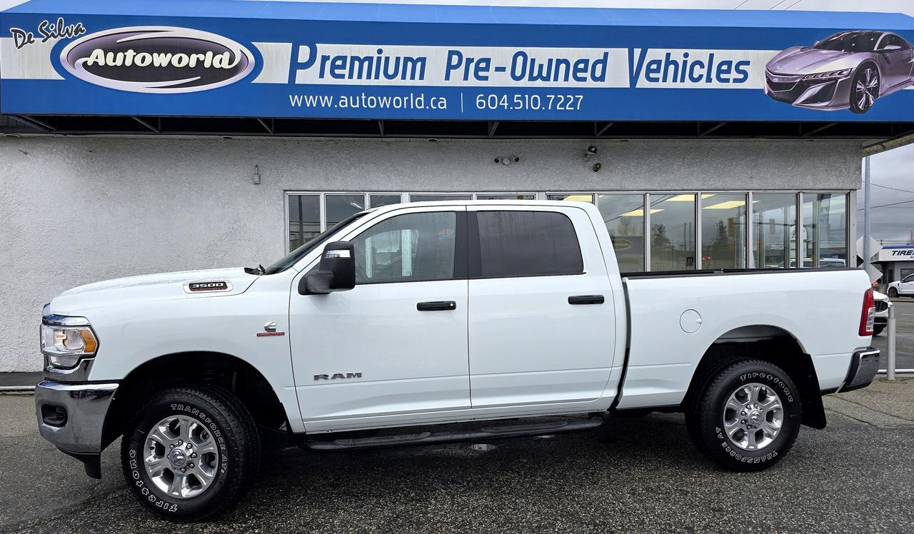 <div><strong>Uncompromising Power. Refined Luxury.</strong></div><div>Experience the pinnacle of heavy-duty performance with this pristine&nbsp;<strong>2024 RAM 3500 Big Horn Crew Cab 4x4</strong>. Finished in a striking&nbsp;<strong>Bright White</strong>&nbsp;with a sophisticated Black and&nbsp;<strong>Diesel Grey premium cloth</strong>&nbsp;interior, this truck offers a commanding presence on any road.</div><div><strong>Performance & Capability:</strong></div><ul><li><strong>6.7L Cummins&reg; Turbo Diesel:</strong>&nbsp;The legendary I-6 powerplant delivering unmatched towing and torque.</li><li><strong>6-Speed Automatic Transmission:</strong>&nbsp;Engineered for smooth, reliable power delivery under heavy loads.</li><li><strong>Selectable Tire Fill Alert:</strong>&nbsp;Precision maintenance for peak performance and safety.</li></ul><div><strong>Premium Level 1 Equipment & Tech:</strong></div><ul><li><strong>Uconnect&reg; 5 with 8.4-inch Display:</strong>&nbsp;Stay connected with&nbsp;<strong>Apple CarPlay&reg;, Android Auto&trade;</strong>, and a 4G LTE Wi-Fi Hotspot.</li><li><strong>Intelligent Mirrors:</strong>&nbsp;Power heated, telescoping, and&nbsp;<strong>automatic power-folding</strong>&nbsp;mirrors with integrated forward and reverse utility lights.</li><li><strong>8-Way Power Adjustable Driver Seat:</strong>&nbsp;Tailored comfort for long-distance hauls.</li><li><strong>18x8-inch Polished Aluminum Wheels:</strong>&nbsp;A gleaming finish that complements the Bright White exterior.</li></ul><div><strong>Peace of Mind:</strong><br>This vehicle boasts a&nbsp;<strong>clean history with no accidents</strong>, ensuring it meets the highest standards of our luxury inventory. From the fog lamps to the hands-free audio, every detail of this Big Horn is designed to elevate your driving experience.</div><p>&nbsp;</p><p>Starting Nov 15 2025 Autoworld Will Not Be Charging Any Documentation fees</p><p>All Prices Are Plus Applicable Sales Taxes</p><p>&nbsp;</p><p>Please Contact Dealer For Warranty Details*** Extended Warranty Available.</p><p>&nbsp;</p><p>For More Details Visit http://Autoworld.ca/</p><p>&nbsp;</p><p>Contact @Autoworld 604-510-7227</p><p>19987 Fraser Highway</p><p>Langley BC</p><p>V3A 4E2</p><p>VSA : 31259</p>
