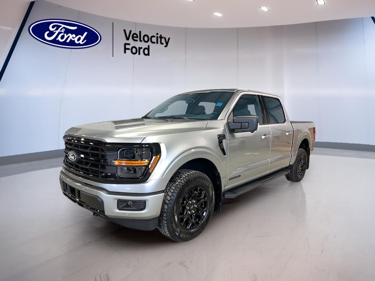 Built to handle work, weather, and weekend travel, the 2026 Ford F-150 XLT 4WD SuperCrew 5.5 Box is a brand new full-size truck that delivers proven capability with smart everyday comfort. Finished in Silver and offered by Velocity Ford in Moose Jaw, this four-door pickup pairs a 3.5-litre unleaded engine with an automatic transmission for confident performance.

The 2026 Ford F-150 XLT 4WD SuperCrew 5.5 Box gives you the space and flexibility many Canadian drivers want in a modern truck. Its SuperCrew cab adds easy rear-seat access, while four-wheel drive, off-road tires, and a strong 4,671 kg towing capacity help this truck stay ready for changing road and jobsite conditions.

FEATURES OF THE F-150 XLT 4WD SuperCrew 5.5 Box
»» SuperCrew cab adds roomy rear passenger space
»» 5.5-foot box supports daily cargo needs
»» Four-wheel drive boosts year-round road confidence
»» XLT trim balances utility and comfort

TRUCK FEATURES
»» Tows up to 4,671 kg confidently
»» Rear tow hook supports truck utility
»» Off-road tires aid rough surface traction
»» Short box helps easier urban manoeuvres

ADVANCED SAFETY FEATURES
»» Backup camera helps with reversing visibility
»» Lane departure warning adds extra awareness
»» Blind spot monitor supports safer lane changes
»» Side and head airbags enhance protection

PERFORMANCE AND EFFICIENCY
»» 3.5-litre unleaded engine delivers solid power
»» Automatic transmission supports smooth daily driving
»» Dual shift mode adds control when needed
»» Four-wheel drive improves traction on loose surfaces

COMFORT AND CONVENIENCE
»» Cruise control supports relaxed highway travel
»» Front air conditioning keeps cabin comfortable
»» Power windows add everyday ease
»» Driver lumbar support improves long-drive comfort

TECHNONOLGY AND CONNECTIVITY
»» Bluetooth integration supports hands-free phone use
»» WiFi hotspot helps keep devices connected
»» Satellite radio expands entertainment choices
»» Steering wheel audio controls simplify access

CARGO SPACE
»» 5.5-foot box handles tools and gear
»» Rear trunk access aids loading convenience
»» Four-door cabin adds flexible storage options
»» Spare tire supports travel peace of mind

WHAT OTHER OWNERS LIKE
»» Strong towing ability for work and trailers
»» Spacious SuperCrew cabin for family comfort
»» Useful driver-assist features for daily confidence
»» Four-wheel drive for winter road assurance

This brand new truck focuses on the features that matter most to many buyers: useful towing strength, a roomy cab, practical technology, and key safety equipment. Heated mirrors, electric mirrors, tinted windows, automatic headlights, LED headlamps, fog lights, anti-lock braking system, stability control, tire pressure monitoring, child safety locks, and automatic door locks all add practical value.

Inside, the 2026 Ford F-150 XLT 4WD SuperCrew 5.5 Box is set up for easy daily use. Power steering, an adjustable steering wheel, illuminated driver and passenger vanity mirrors, rear window defroster, passenger airbag sensor, and durable cloth seating all support comfort and convenience without adding unnecessary complexity.

For drivers in Moose Jaw who need a new truck with real capability and straightforward features, this 2026 Ford F-150 XLT 4WD SuperCrew 5.5 Box stands out as a smart choice. It is ready for towing, commuting, hauling, and all-season travel with the confidence expected from a full-size Ford pickup.

This 2026 Ford F-150 XLT 4WD SuperCrew 5.5 Boxs VIN is: 1FTFW3LDXTFA36059.